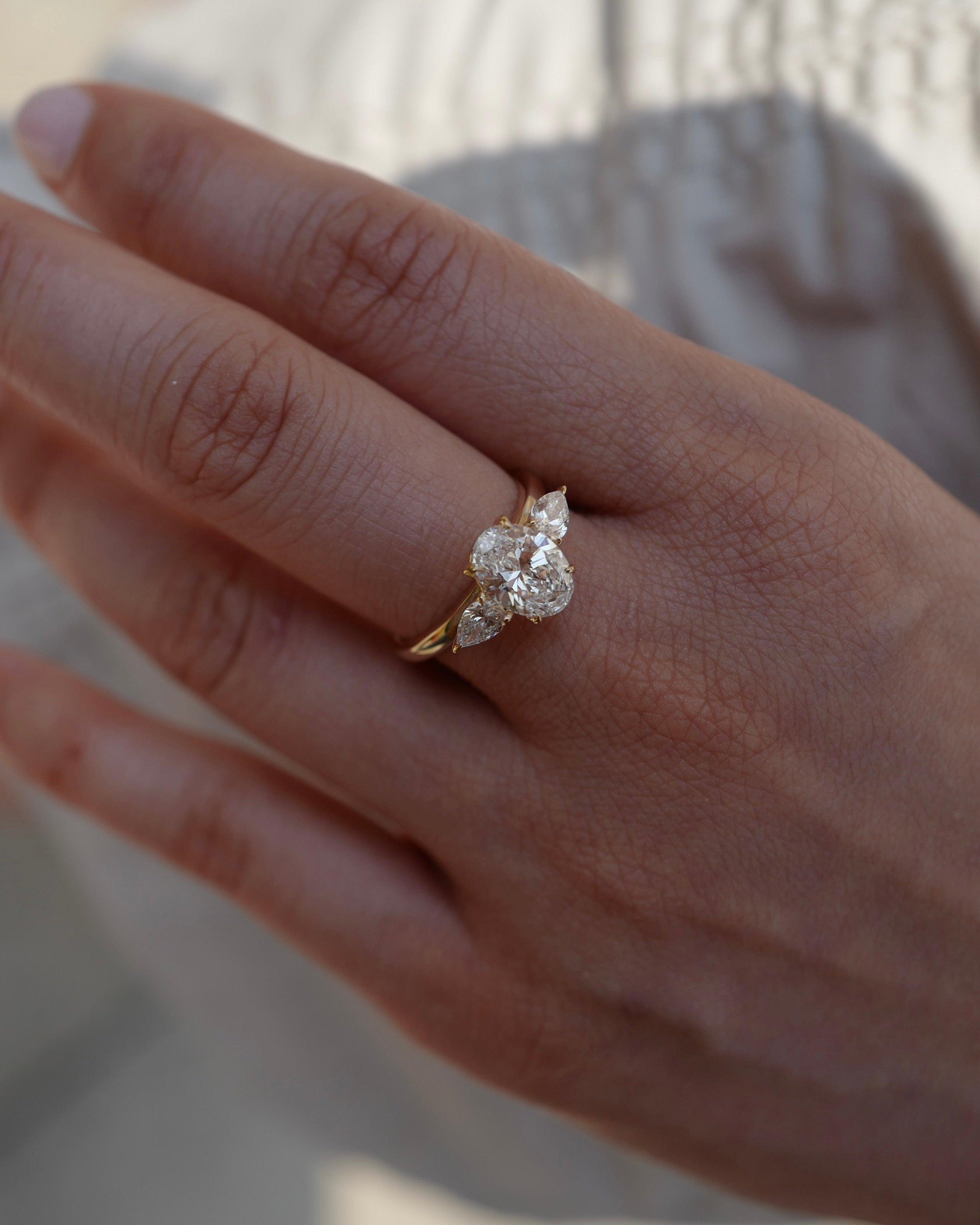 Oval & Pear Three-Stone Ring