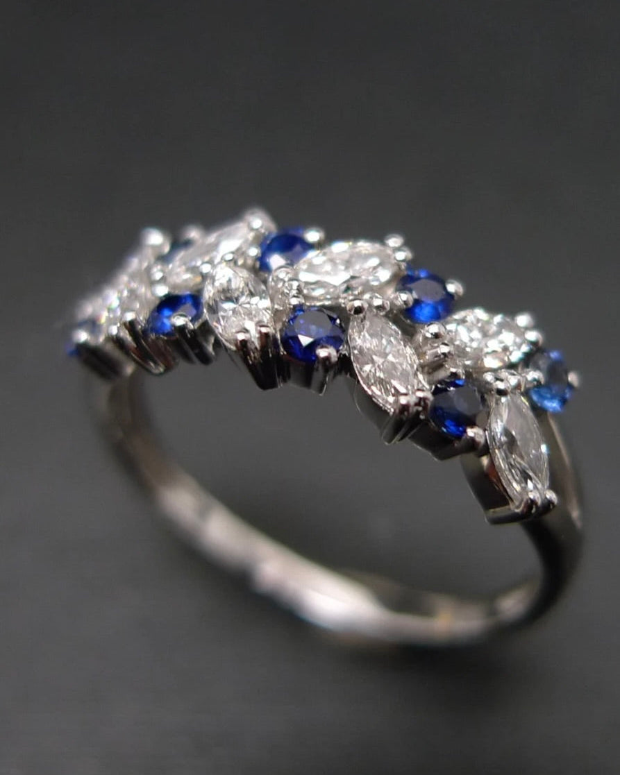 Elegant gold ring with blue sapphires and diamonds