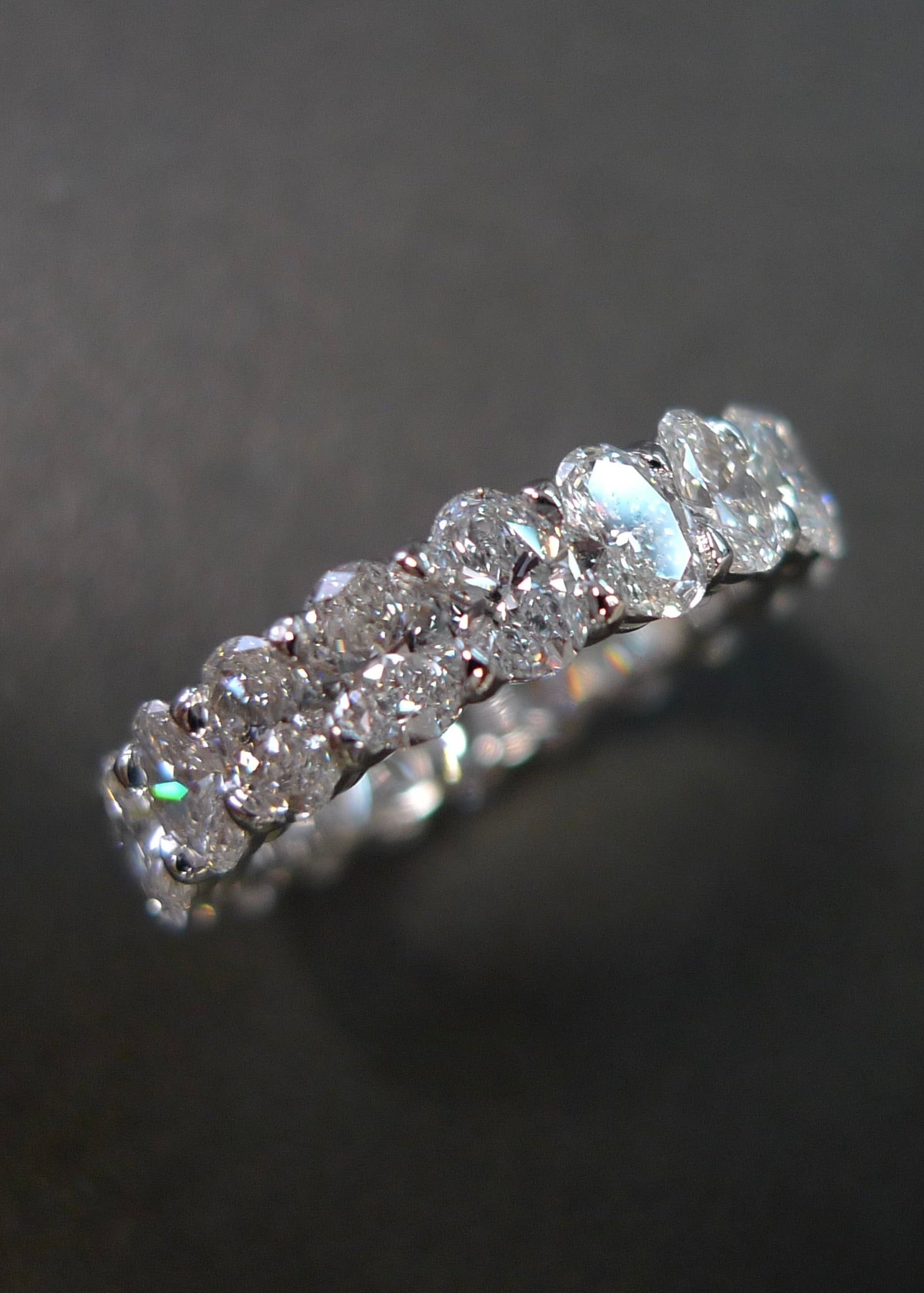 Elegant full eternity band with oval cut diamonds in white gold