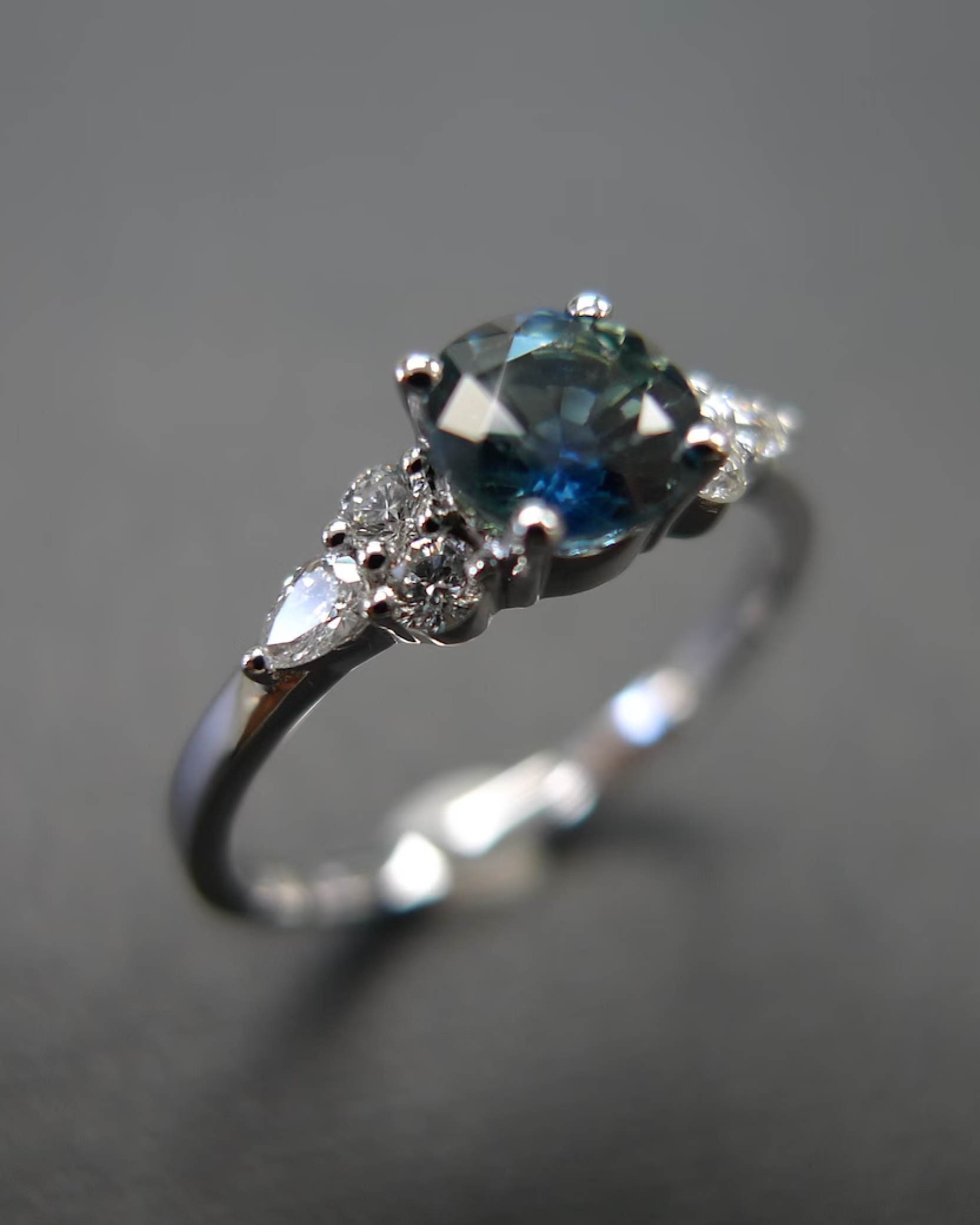 Natural teal blue-green sapphire engagement ring