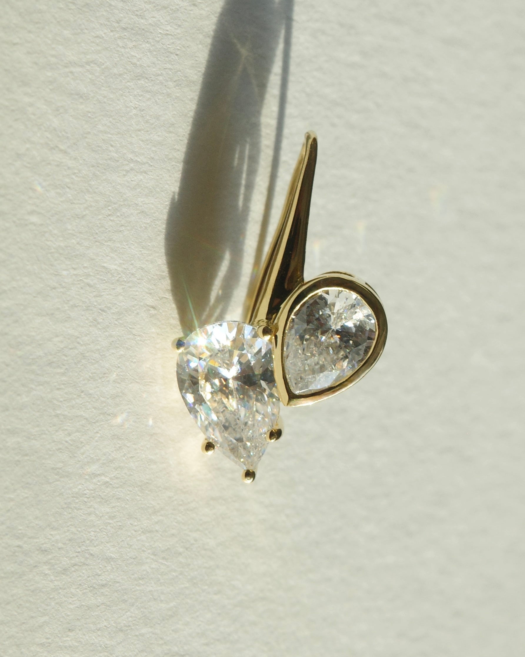 teardrop diamond dangle hoop earring close up