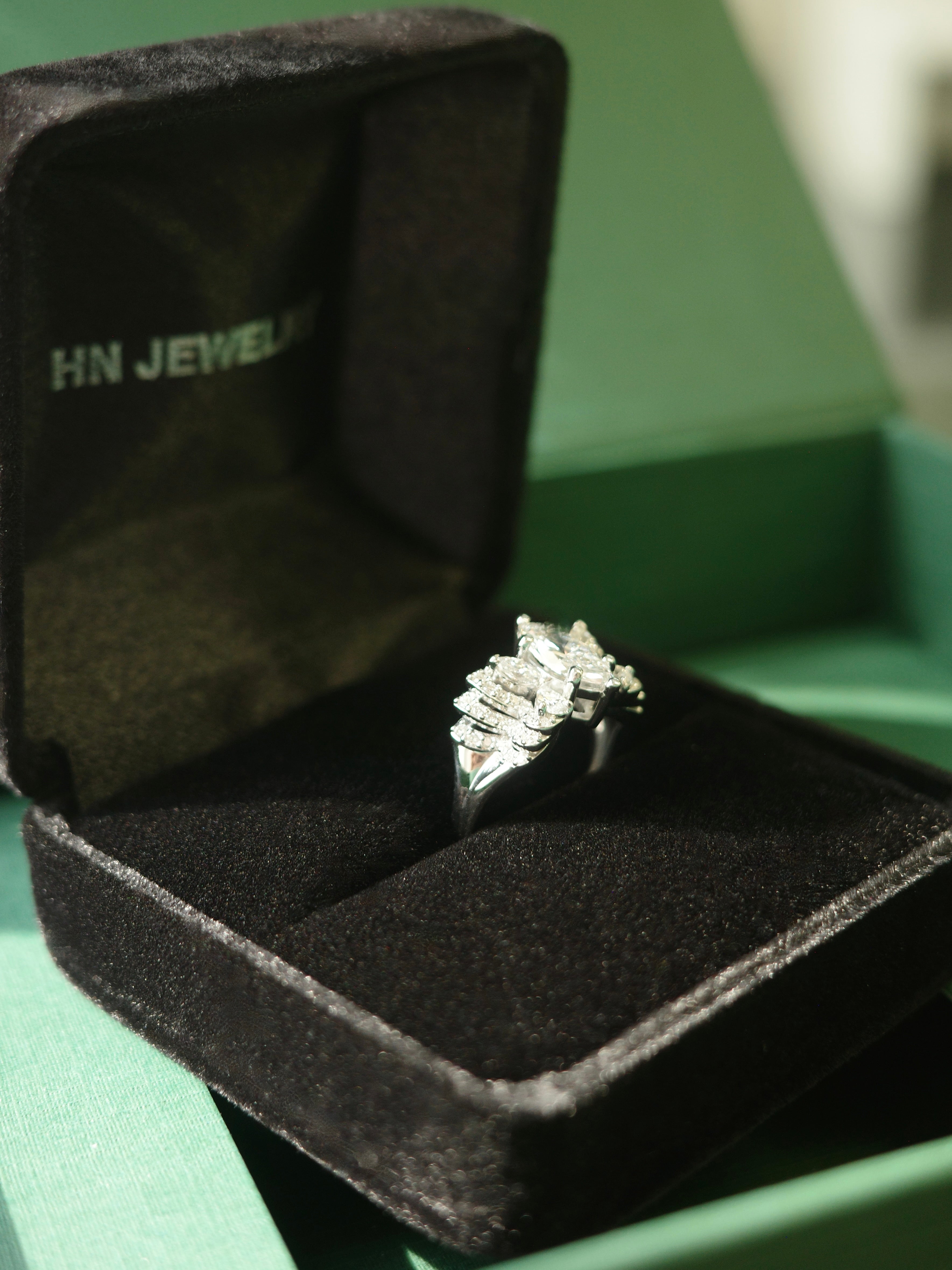 1ct Marquise Diamond ring in a black jewelry box with 'HN Jewelry' branding.