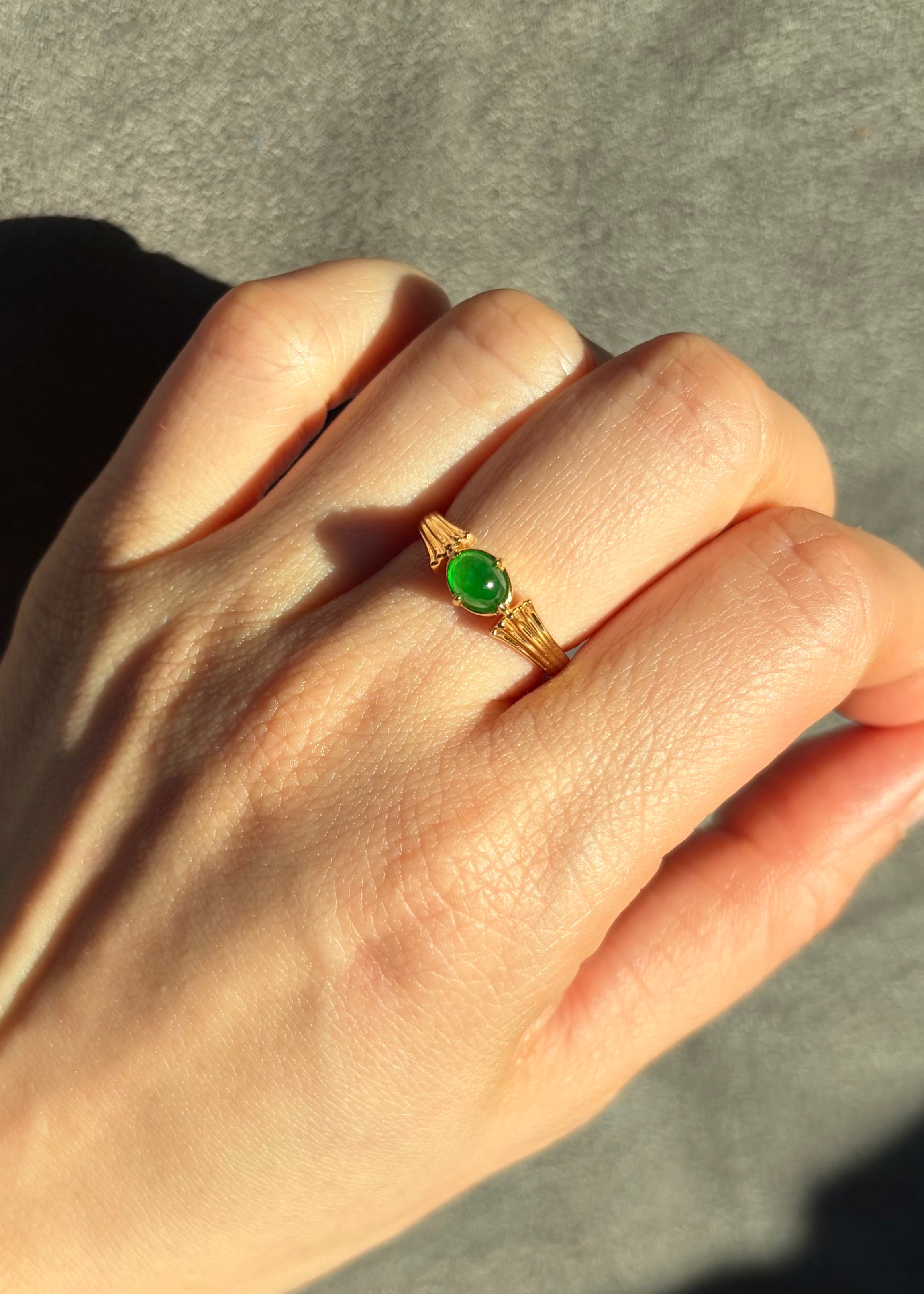 Elegant jade solitaire ring in solid yellow gold