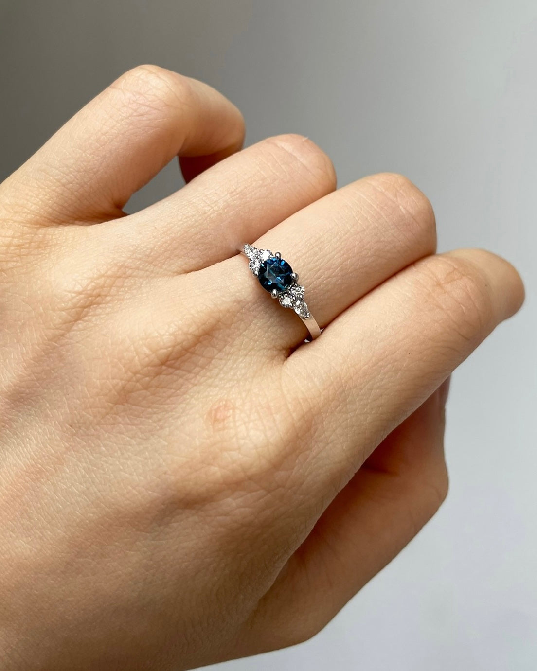 Natural teal blue-green sapphire engagement ring