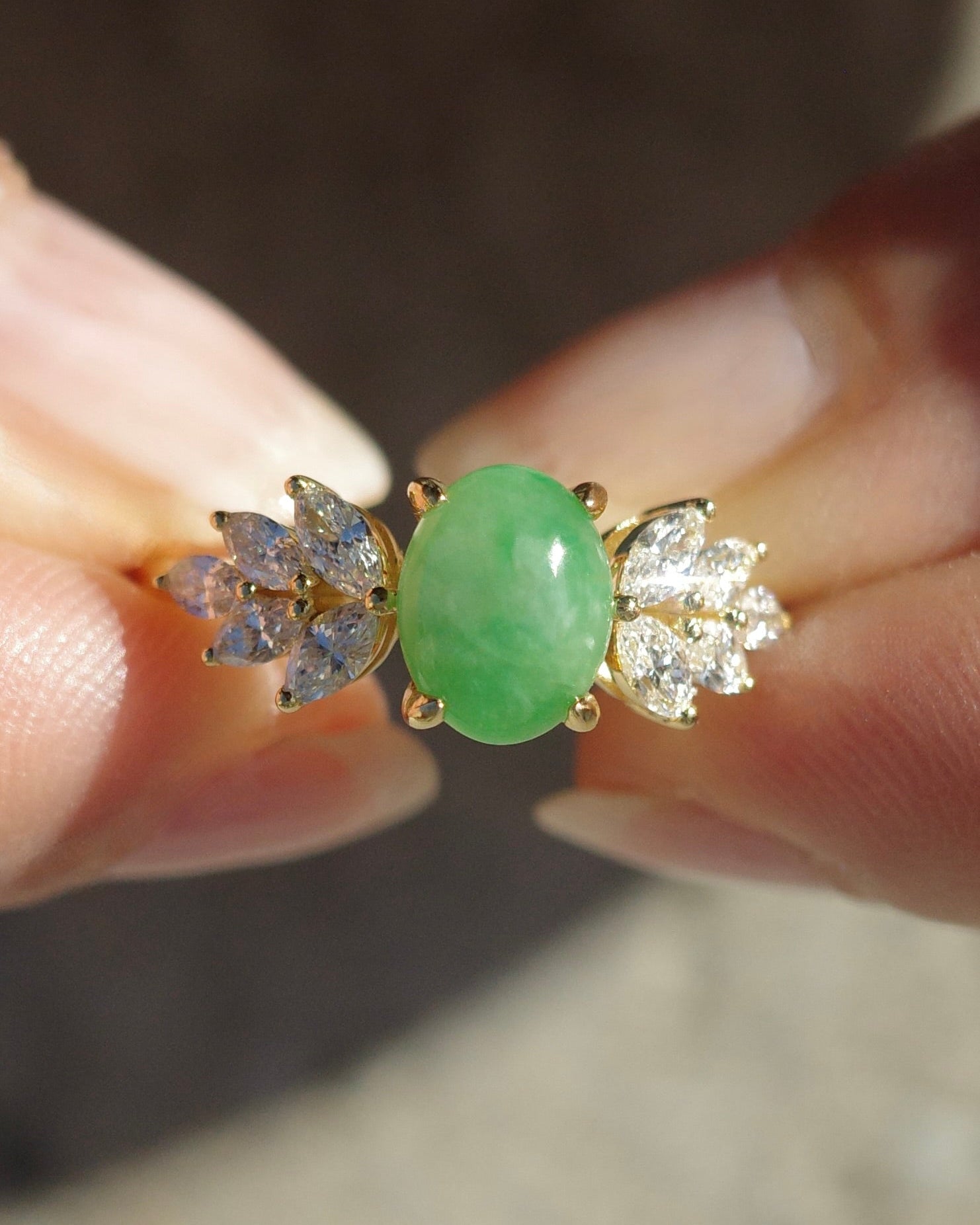 Natural jade cabochon center stone and diamond leaf design in gold ring