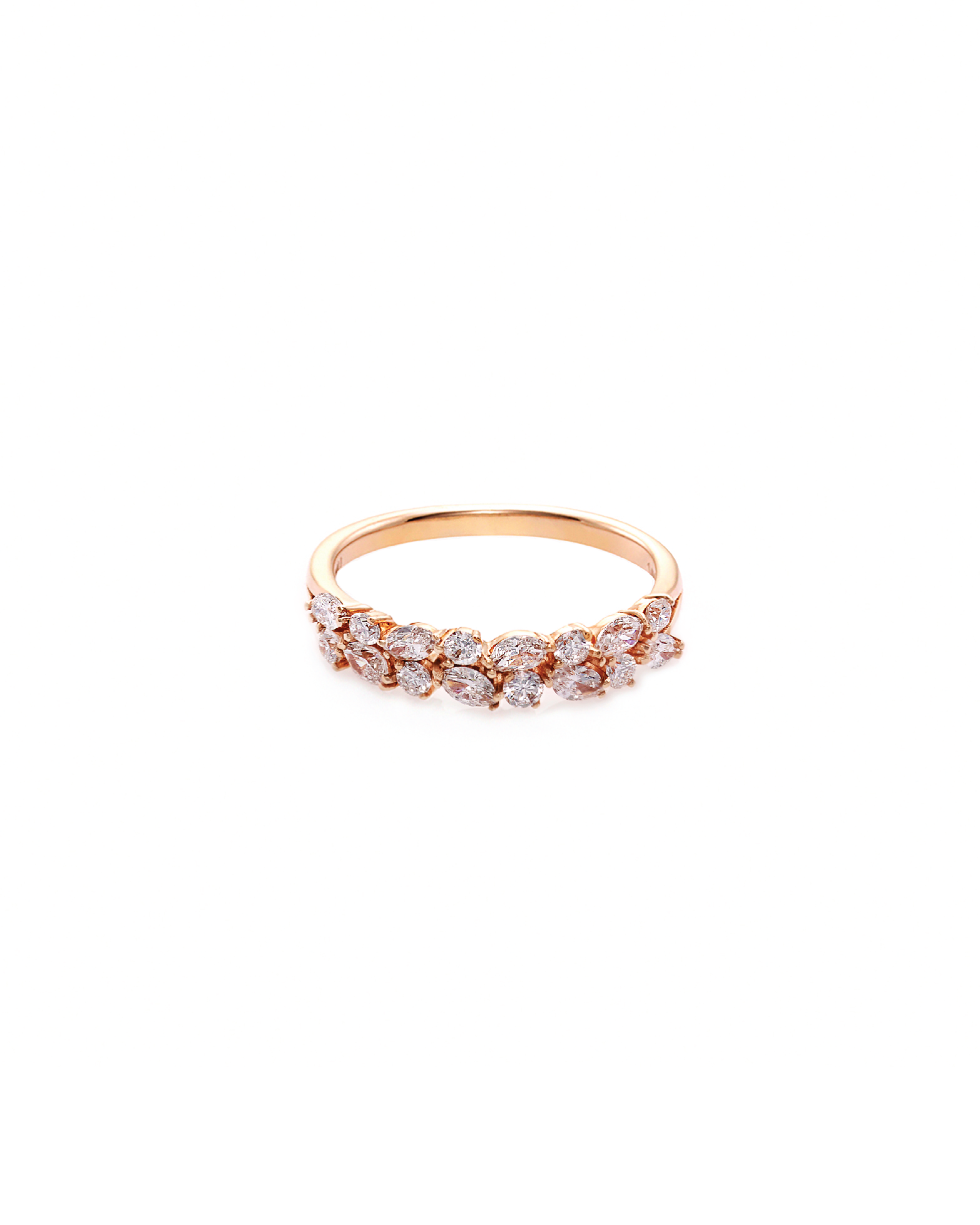 A rose gold ring with alternating marquise and round diamond patterns on the top.