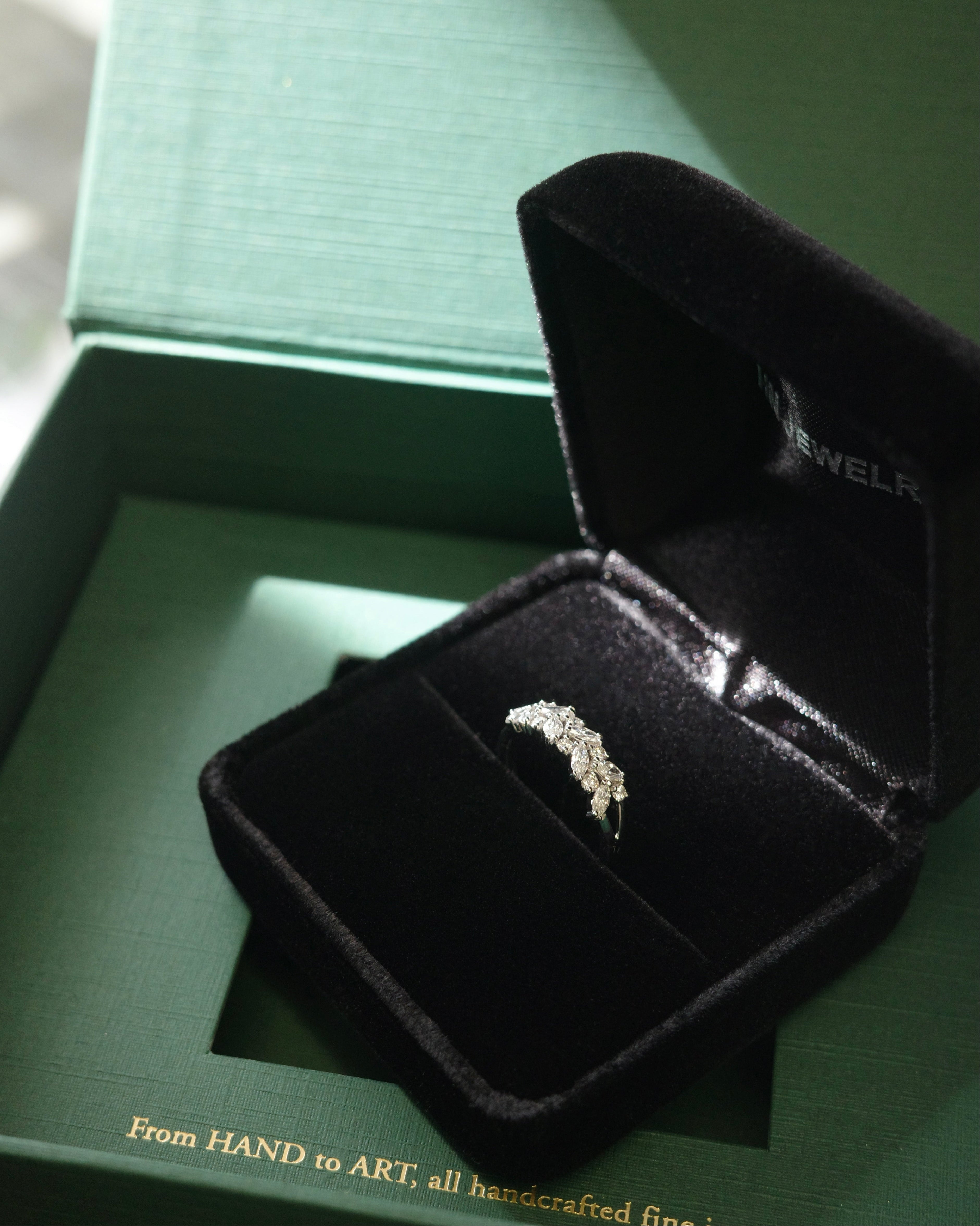 handcrafted marquise diamond ring in 18k white gold in a ring box