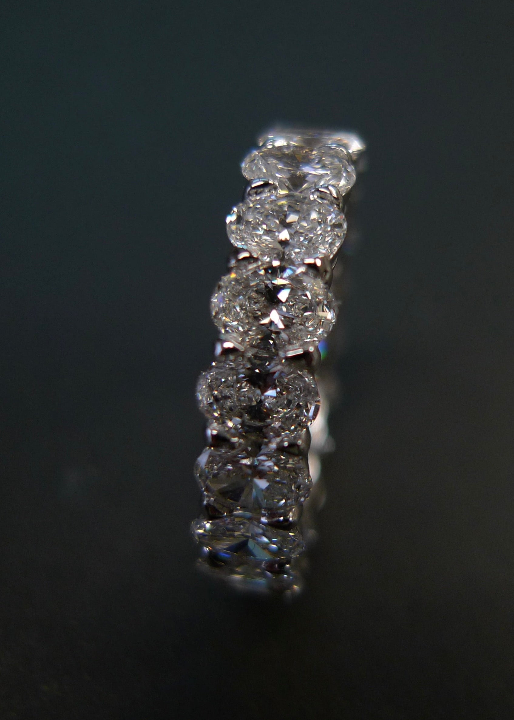 White gold eternity ring set with sparkling oval diamonds