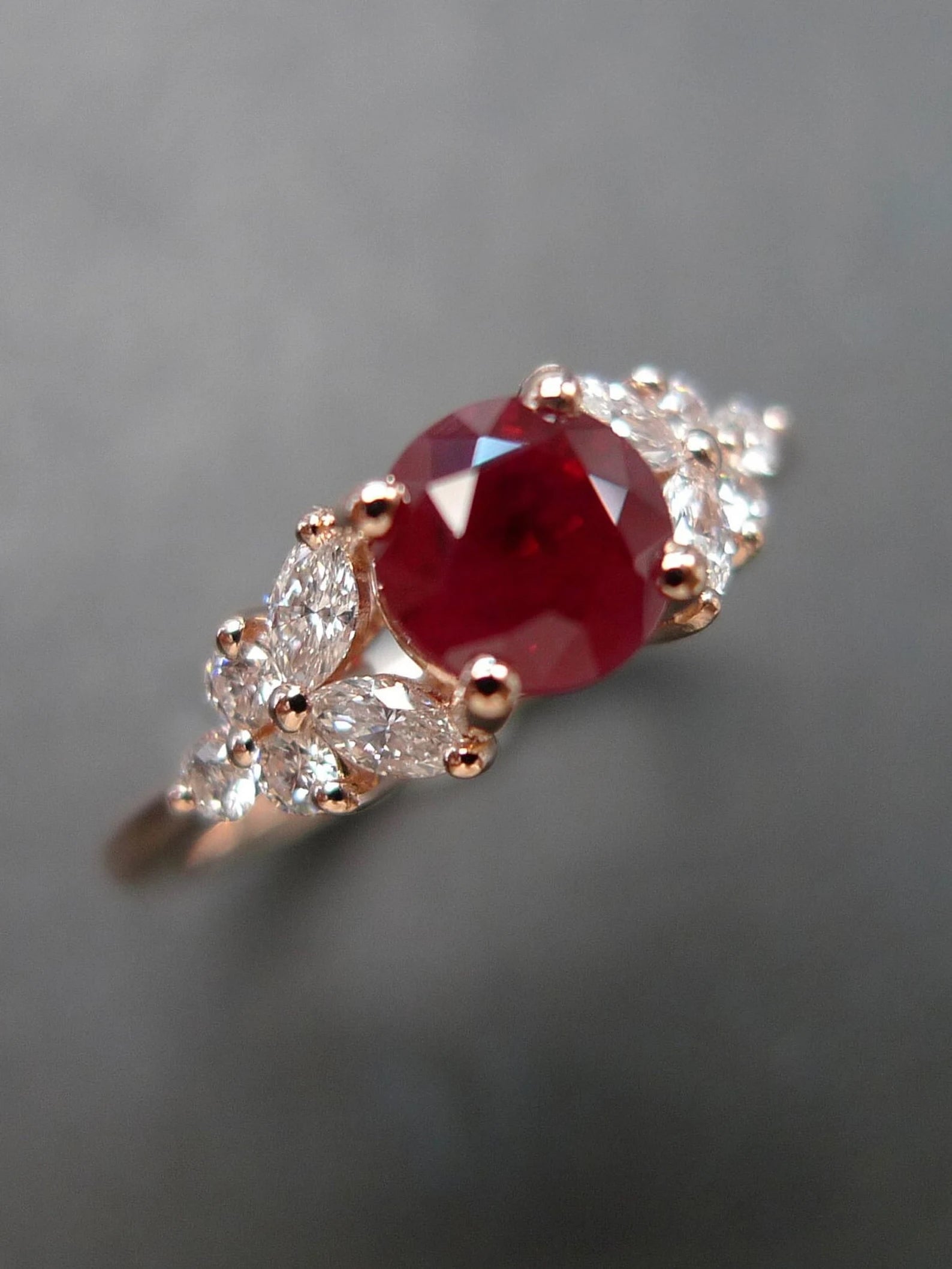 Elegant 18k rose gold ruby and diamond ring suitable for engagement or anniversary