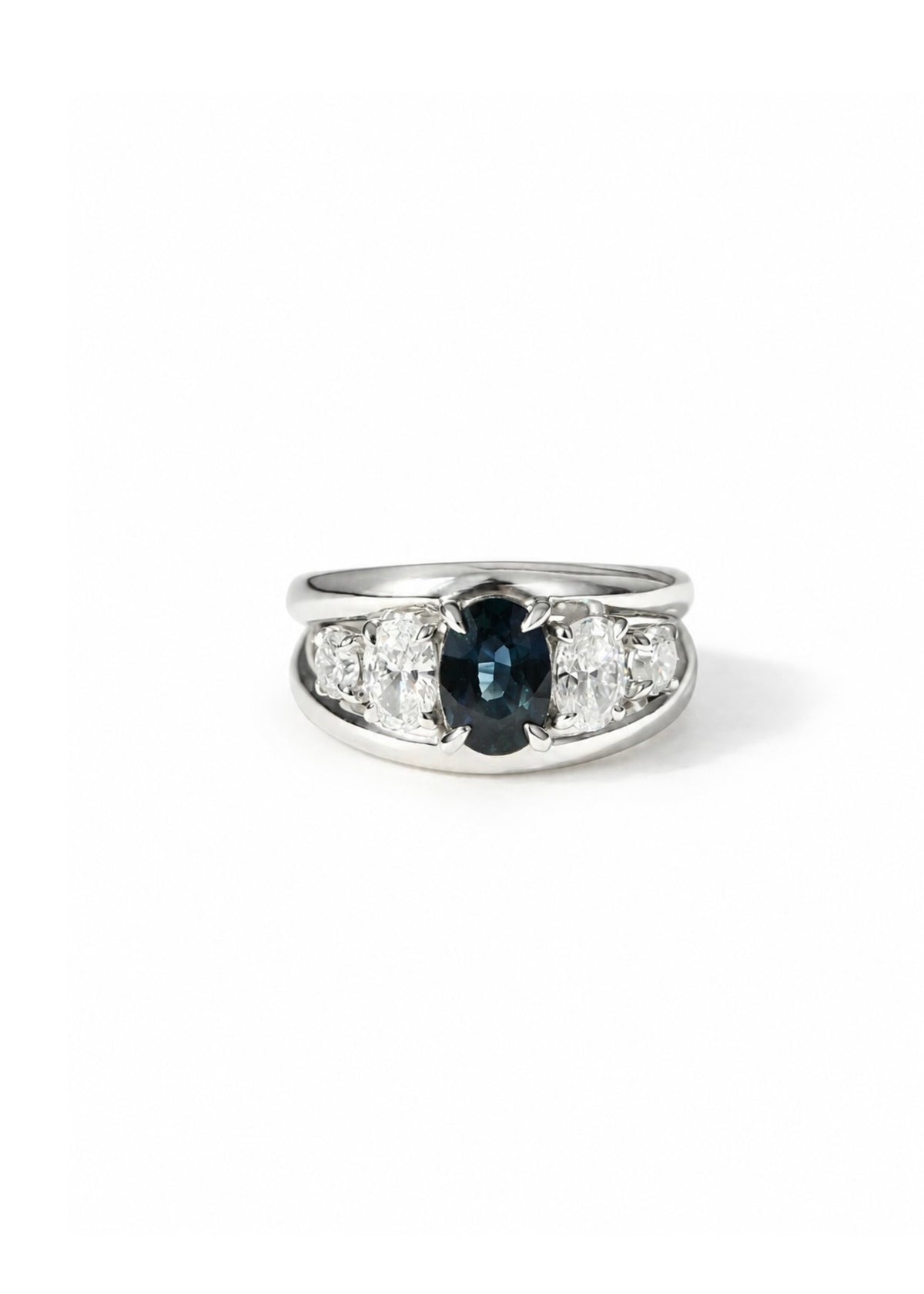 Luxury 14k white gold statement ring set with rare teal sapphire and conflict-free diamonds.