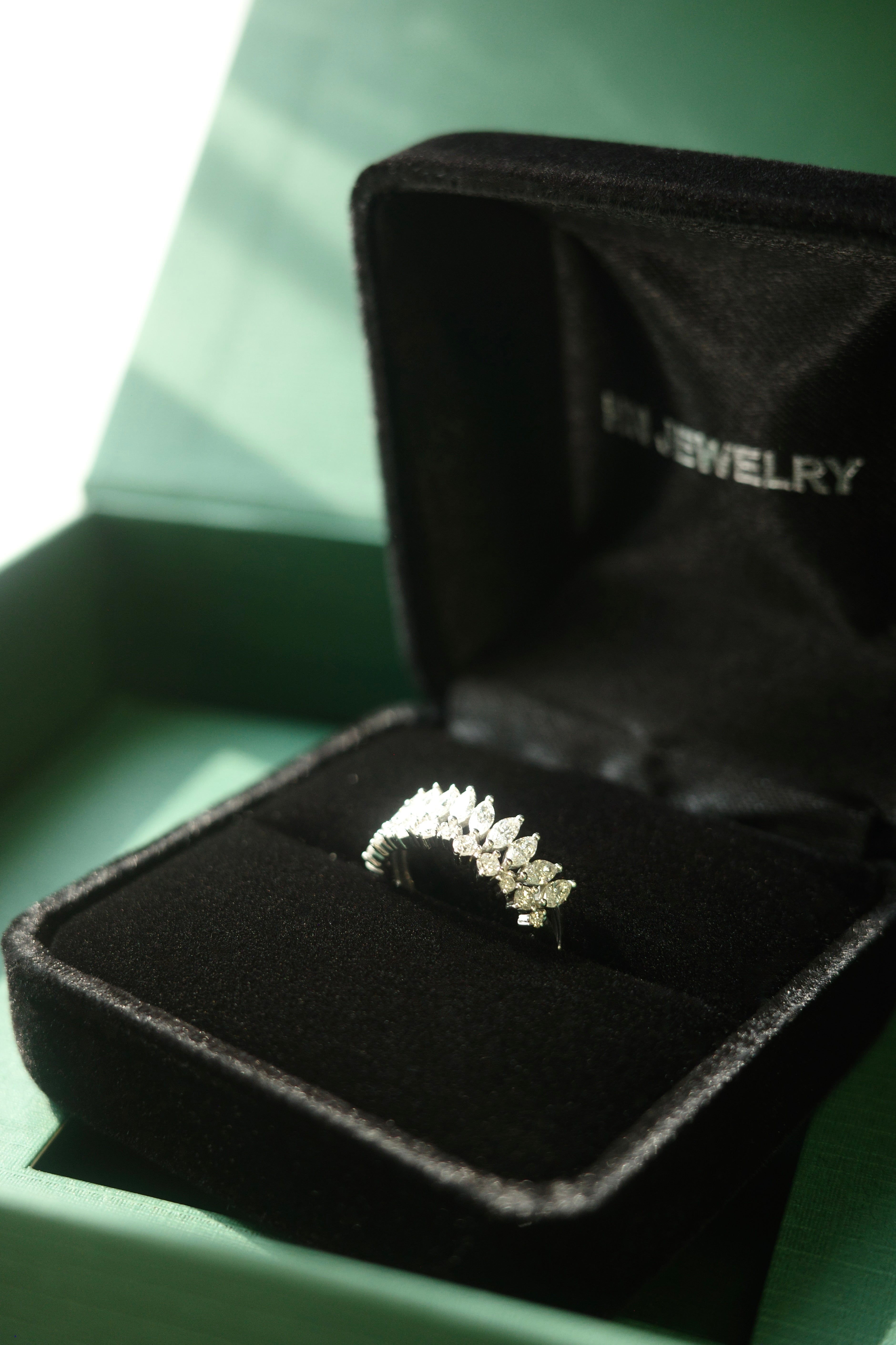 Marquise and round diamond wedding band with crown silhouette