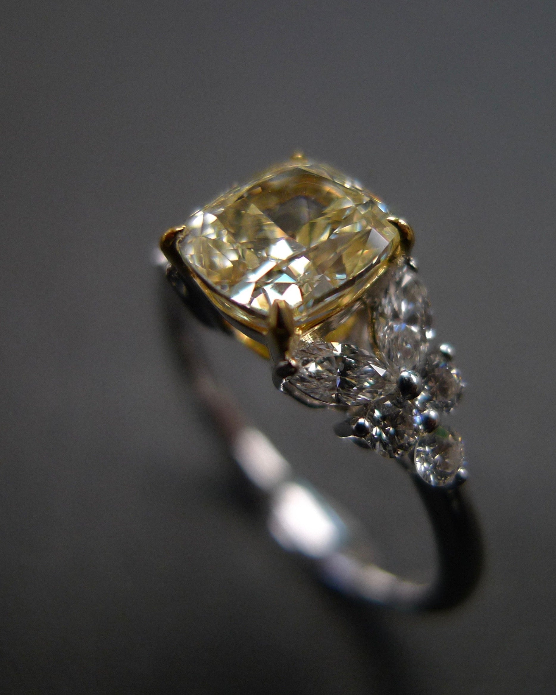 Handcrafted yellow cushion diamond ring with marquise diamonds – fine jewelry design