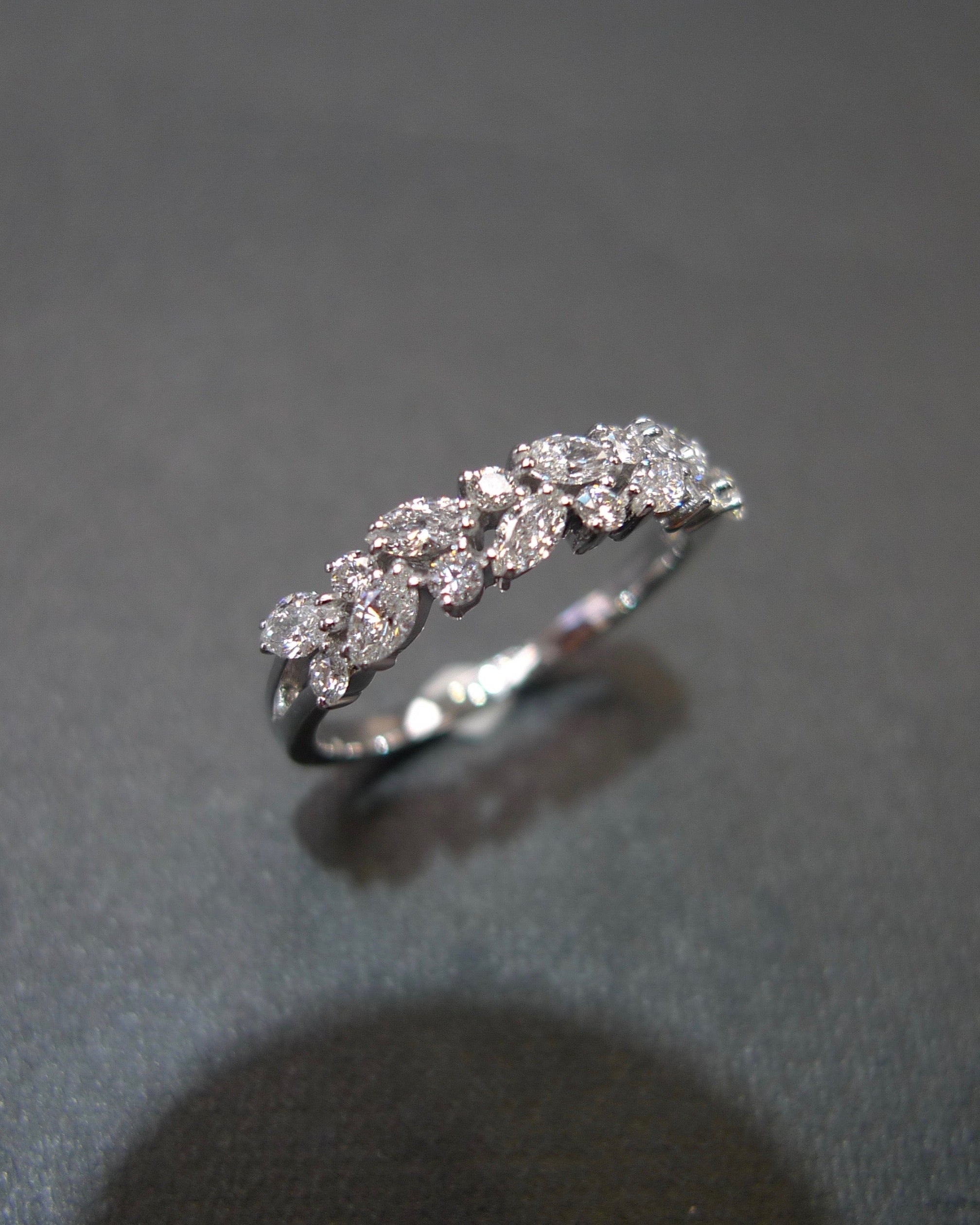 Handmade thin white gold band with marquise diamond accent