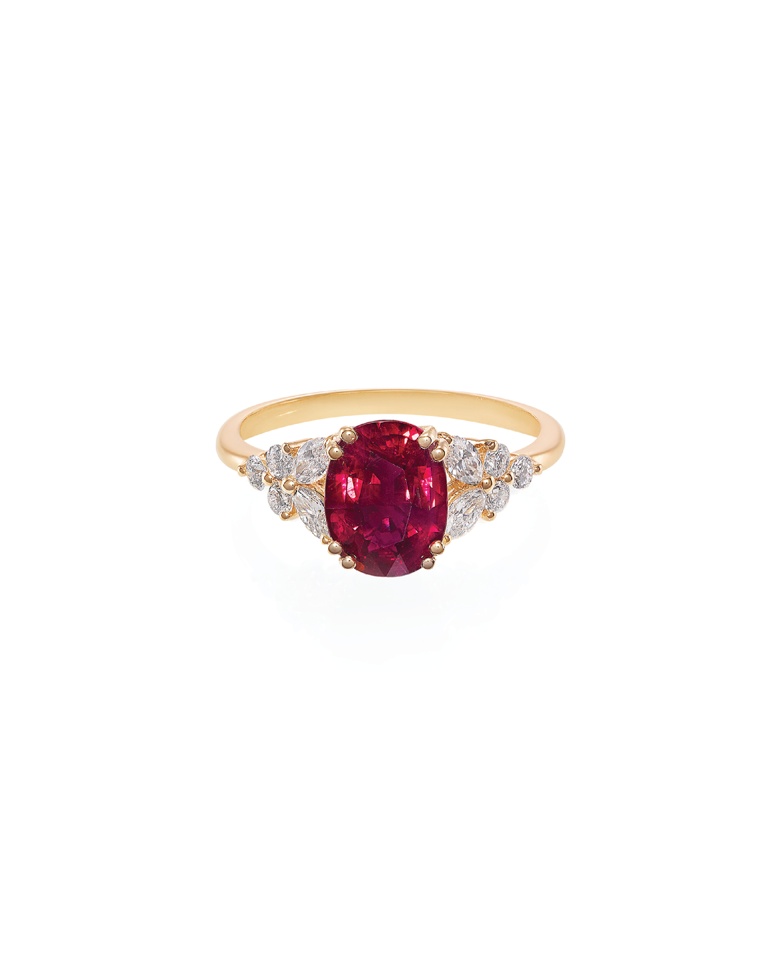 A cushion shape ruby ring with marquise and round brilliant cut diamonds set in 18K yellow gold.