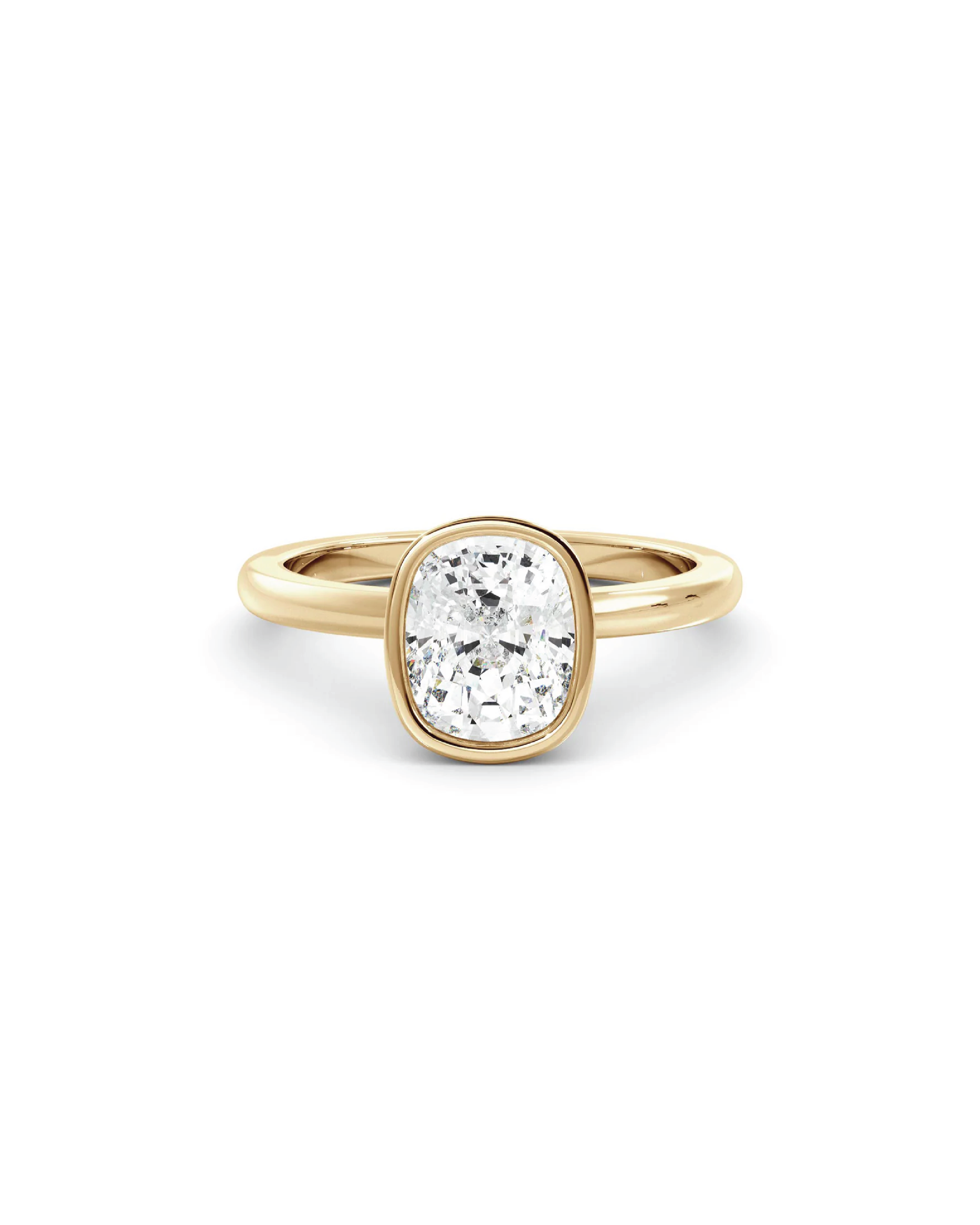 A cushion bezel solitaire ring with a single diamond in 18K yellow gold.