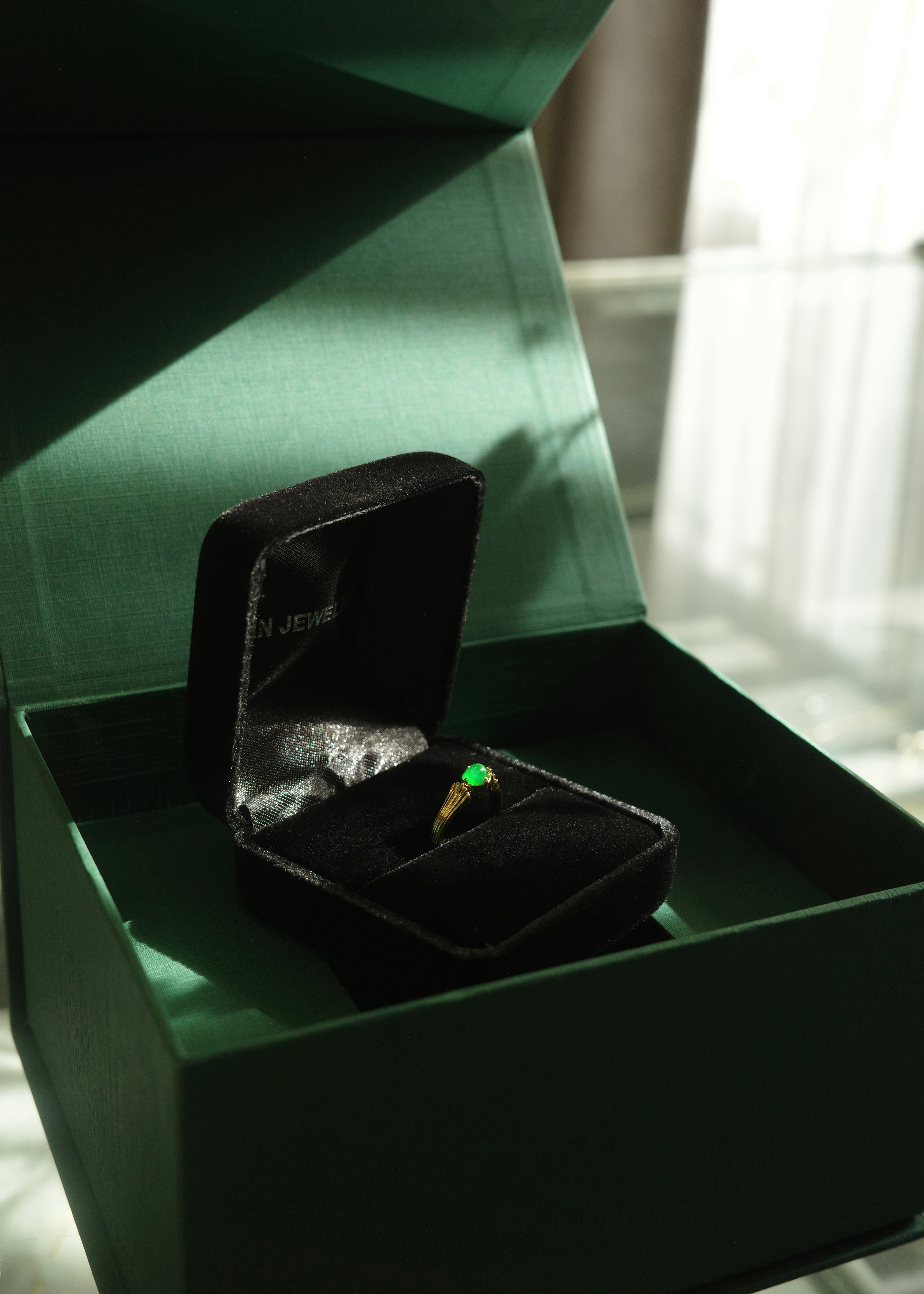 Certified jade cabochon ring in warm yellow gold