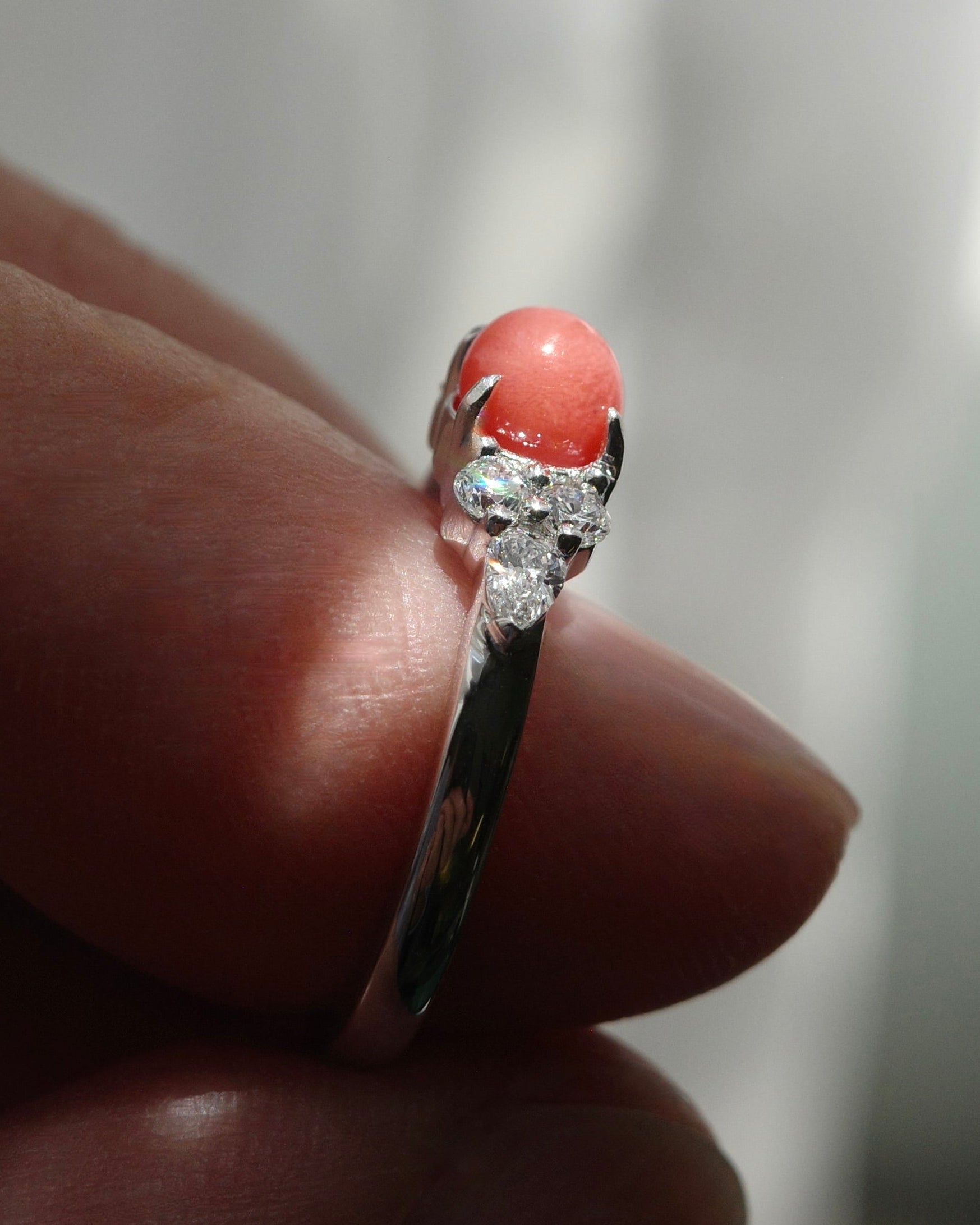 Close-up capturing the fiery intense flame pattern vividly visible on the surface of the 0.68ct red conch pearl.