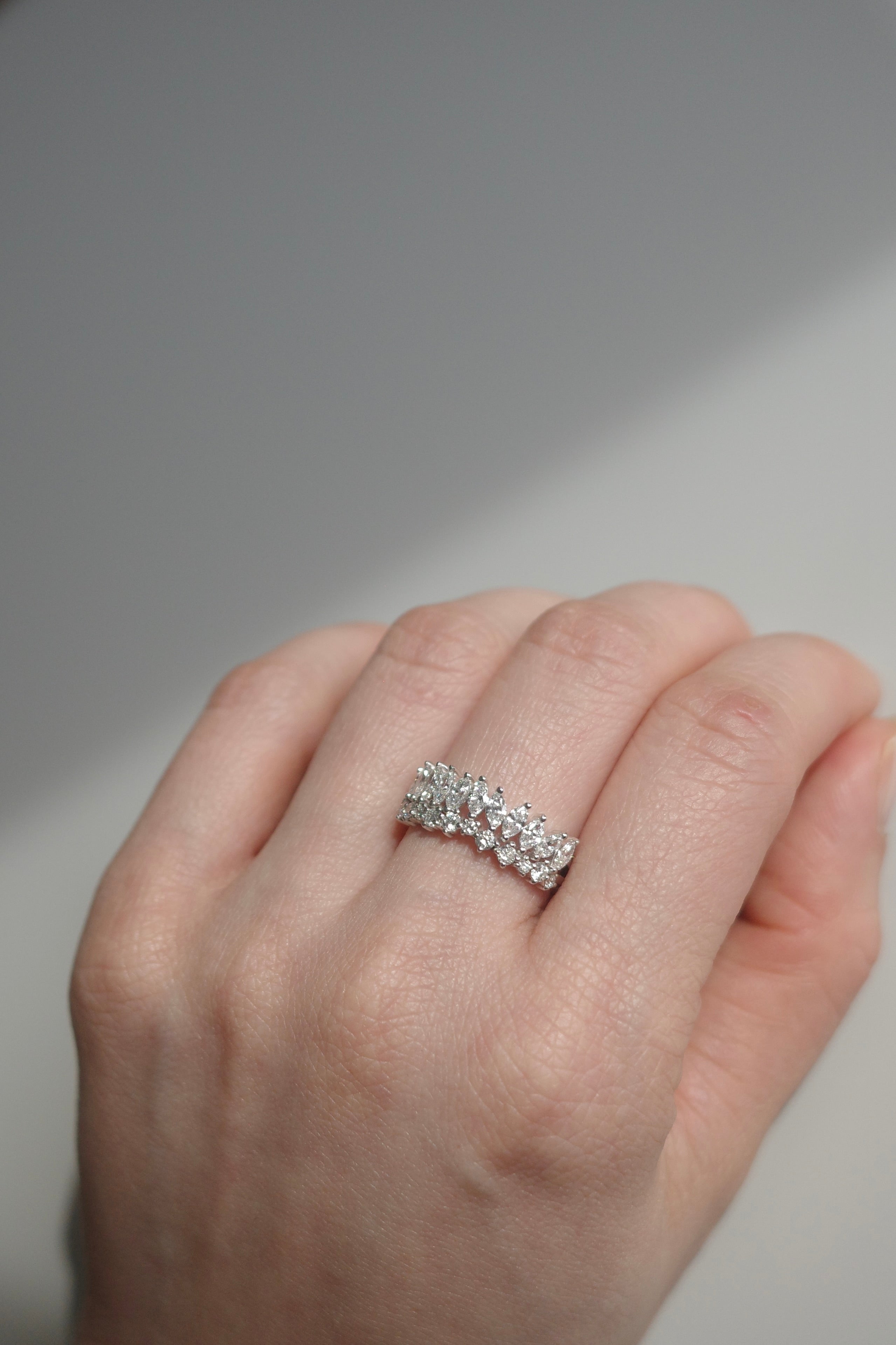 Elegant tiara ring with marquise and round diamonds in white gold