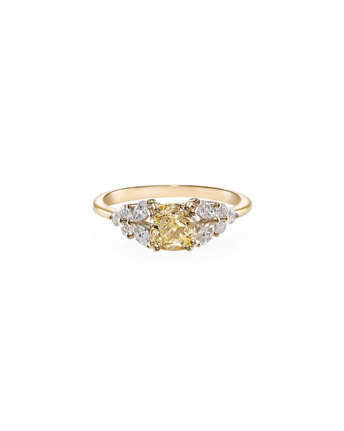 A cushion-shaped yellow diamond ring with round and marquise cut diamonds set in a 14K yellow gold band.