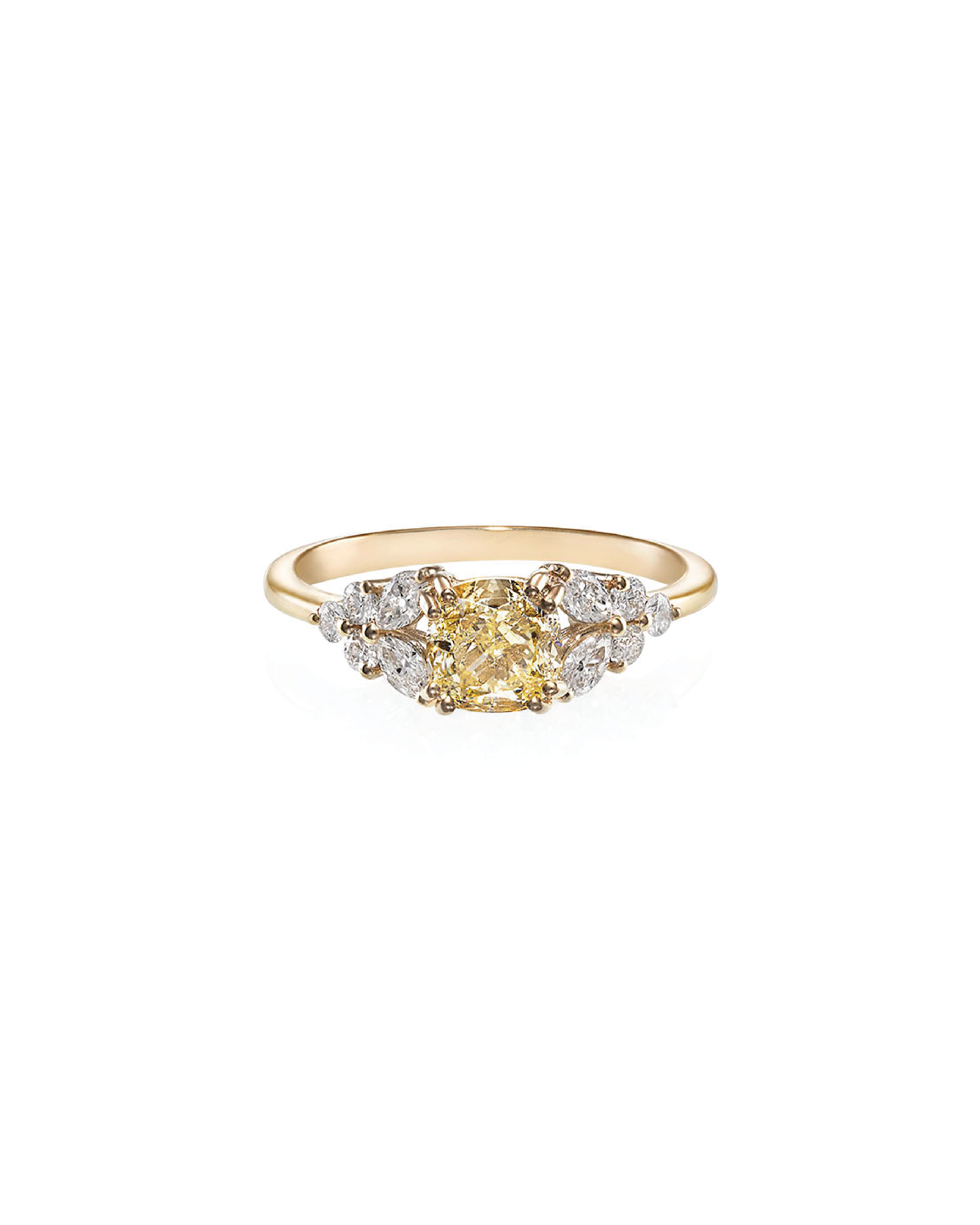 A cushion-shaped yellow diamond ring with round and marquise cut diamonds set in a 14K yellow gold band.