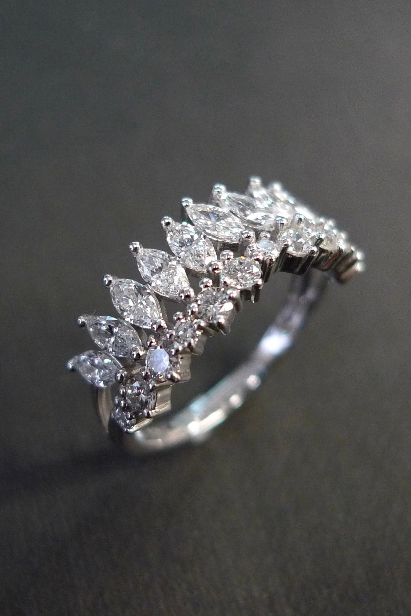 Close-up of marquise and round diamond tiara band in white gold