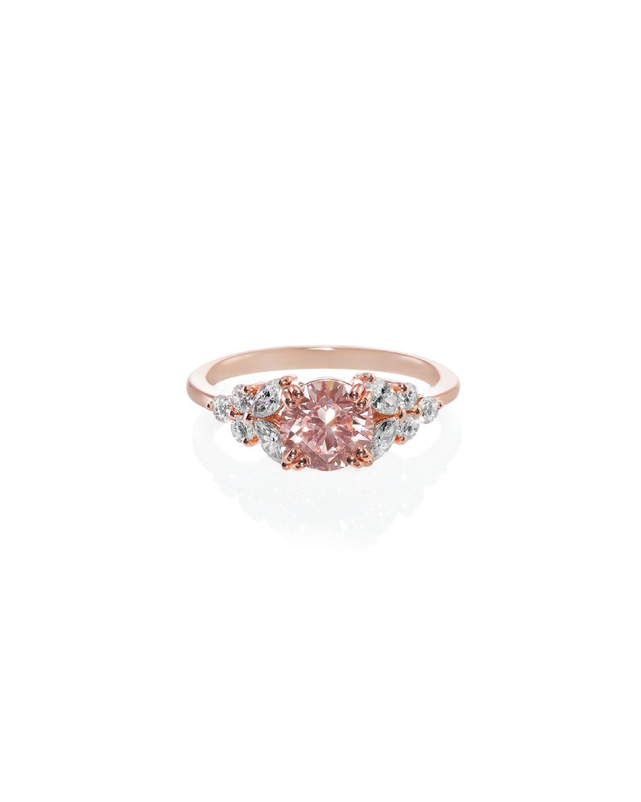 A rose gold ring with a central round brilliant cut pink diamond, surrounded by cushion and marquise cut diamonds.