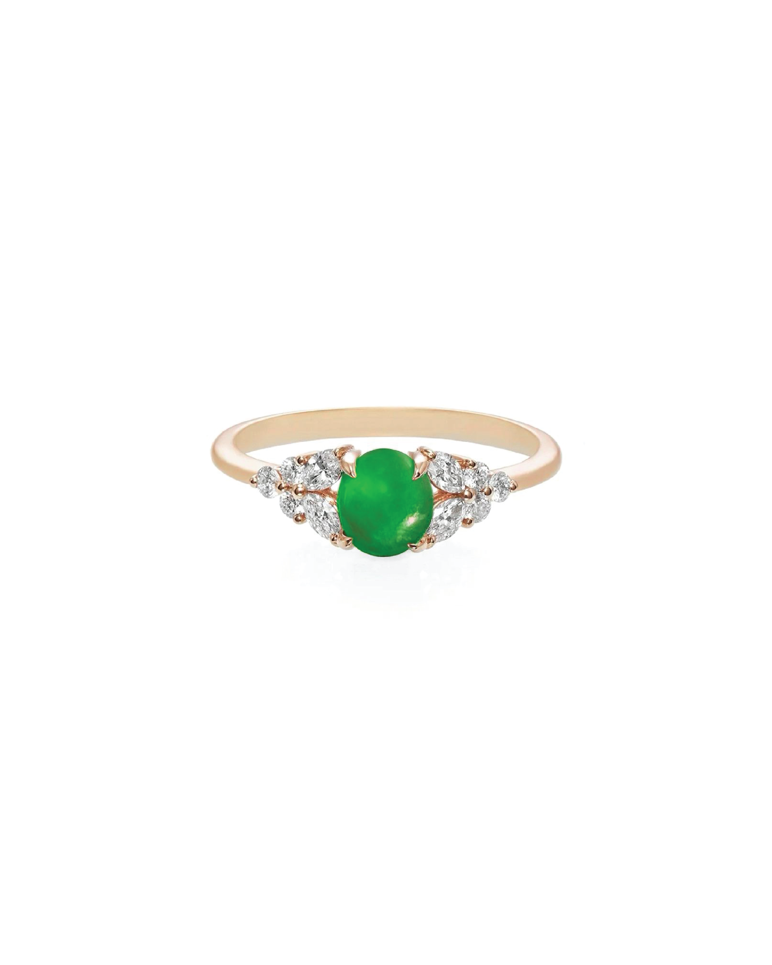 Ring with a green gemstone and diamond accents on a white background