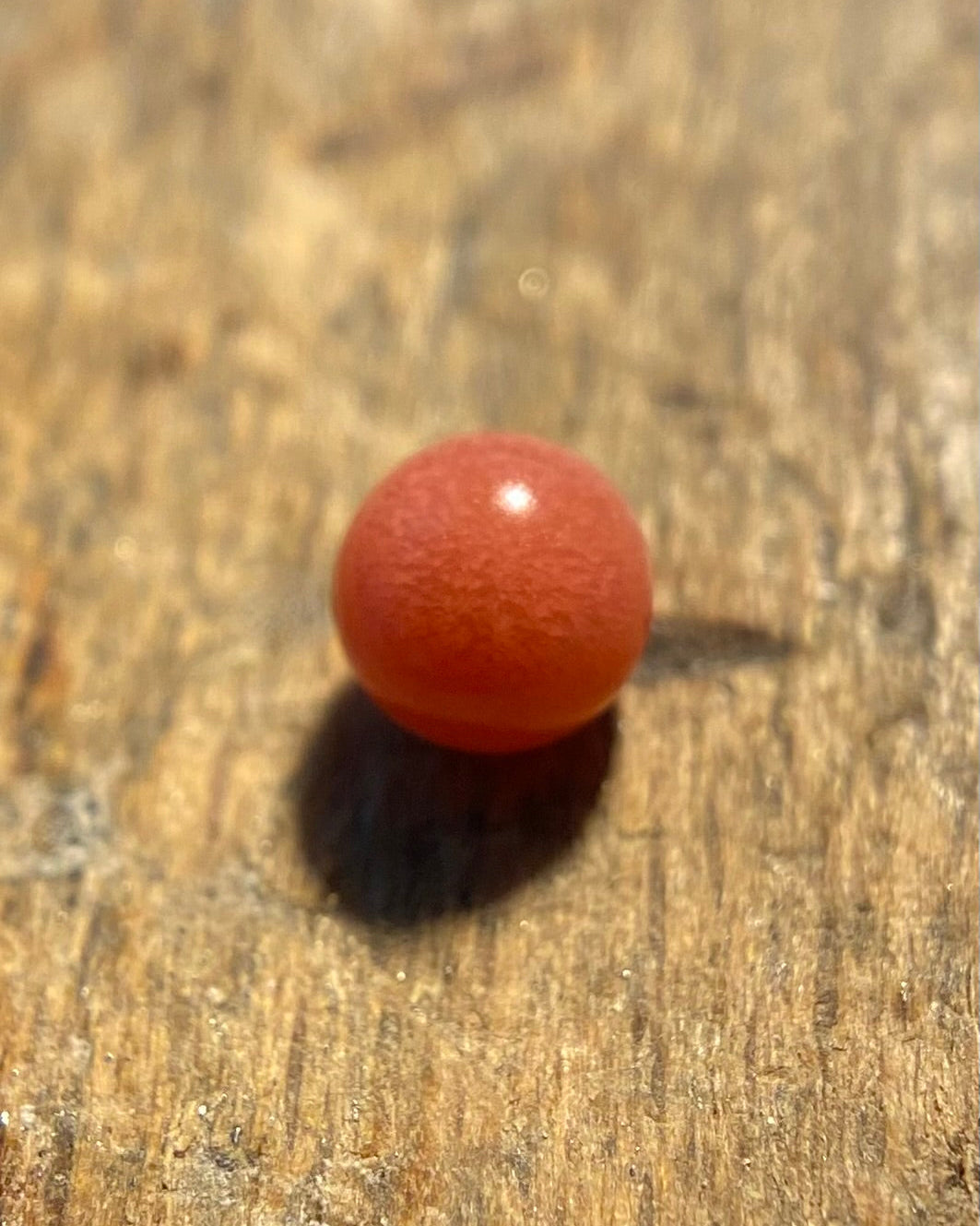 A single round loose red natural conch pearl with lot of flames