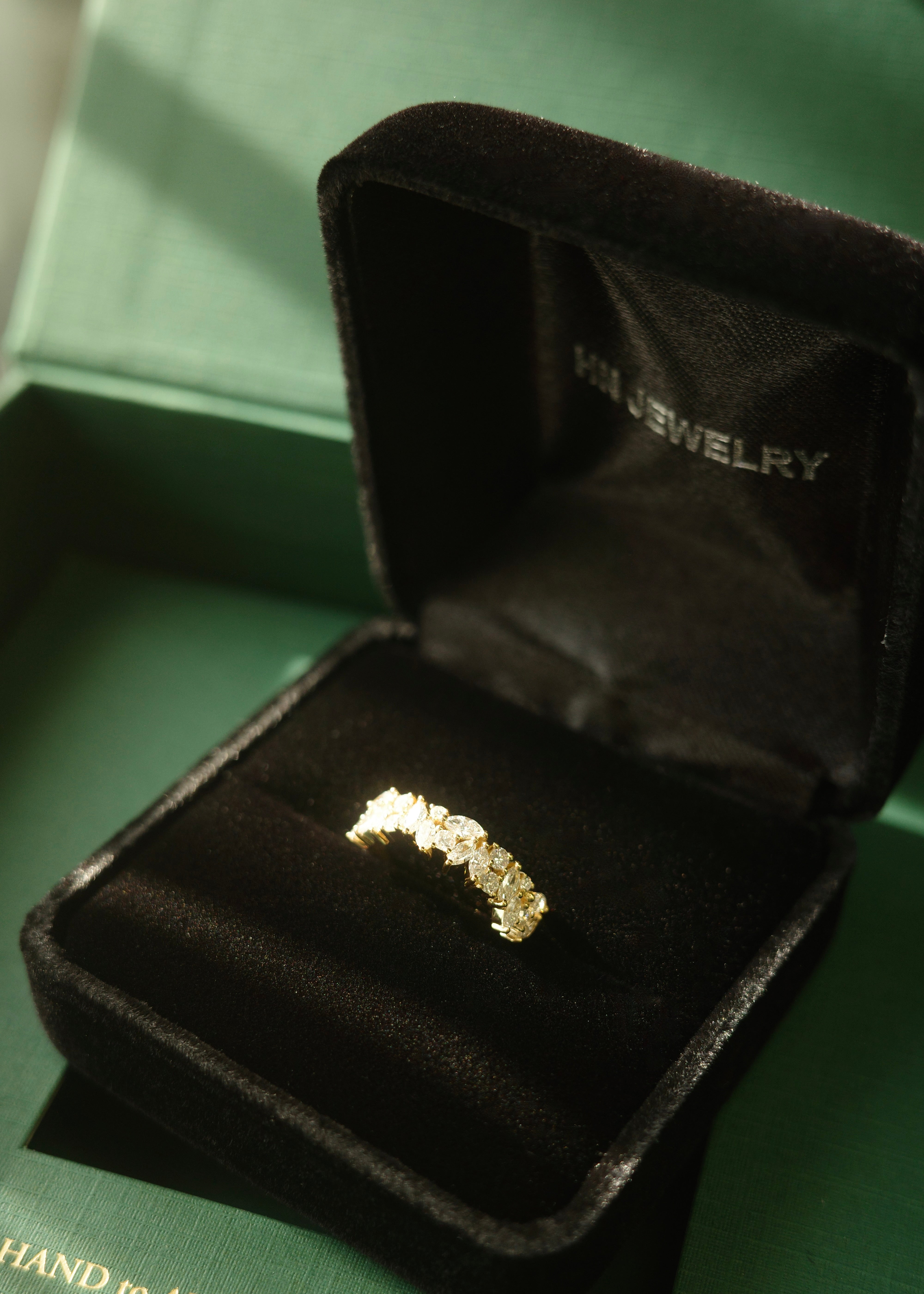 Marquise diamond eternity band in solid yellow gold