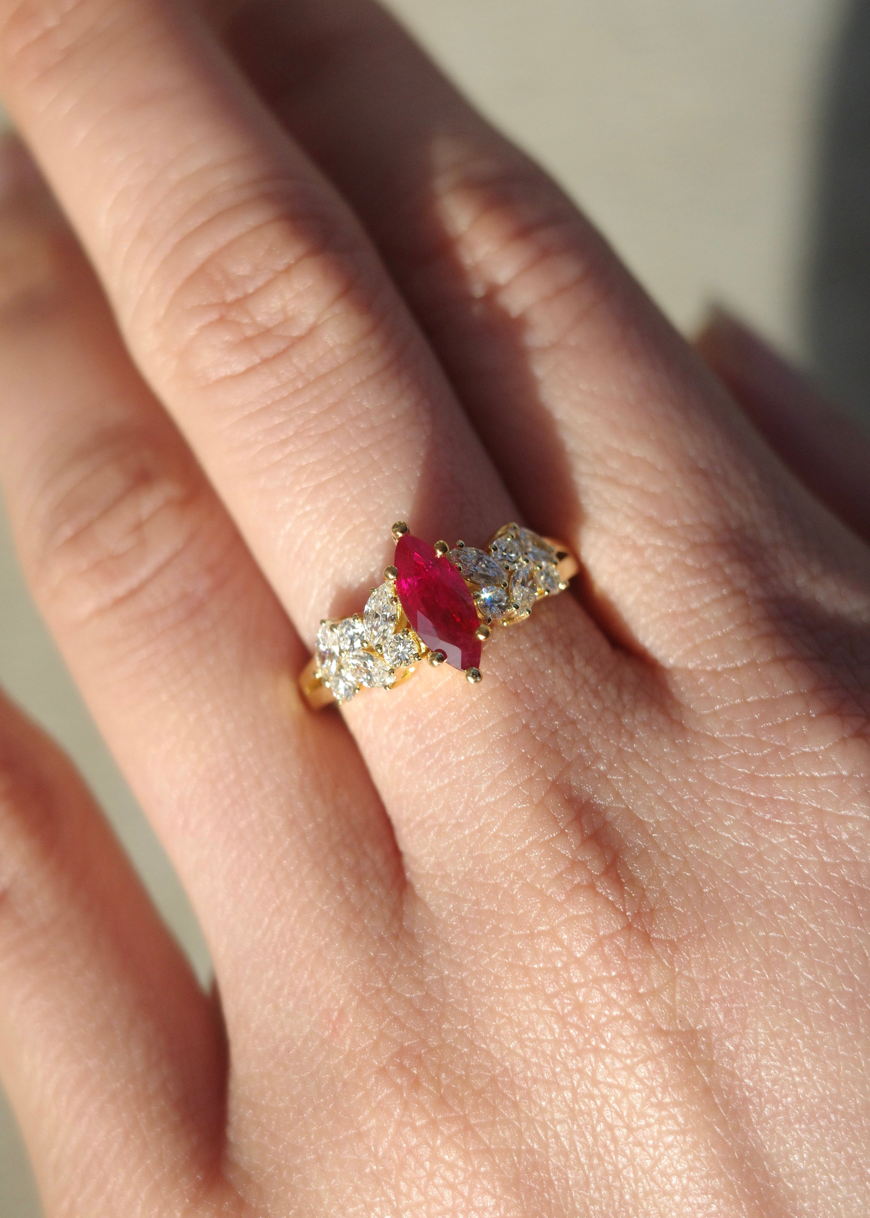 Ruby and diamond ring in solid gold with marquise center stone