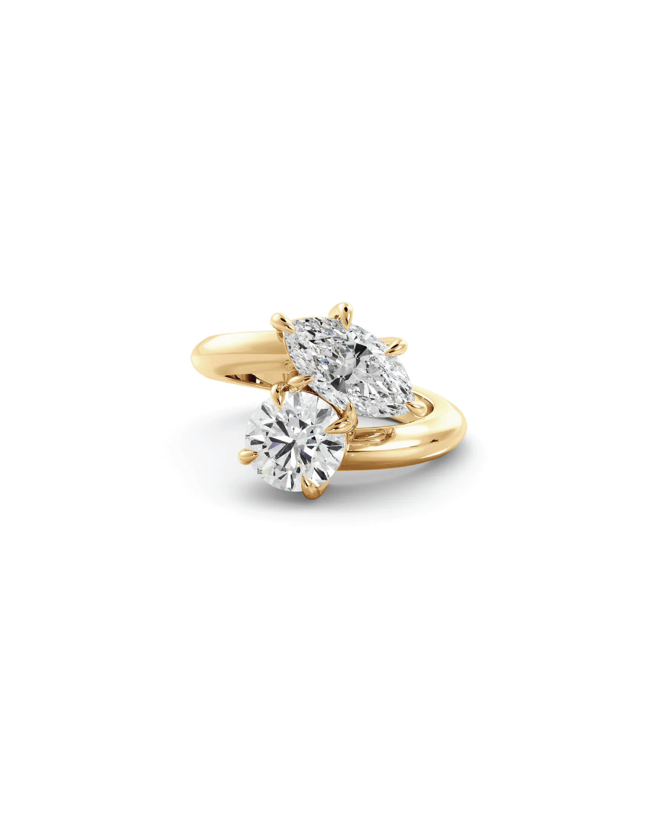 A toi et moi ring featuring a marquise diamond with a round diamond, set in 18K yellow gold.