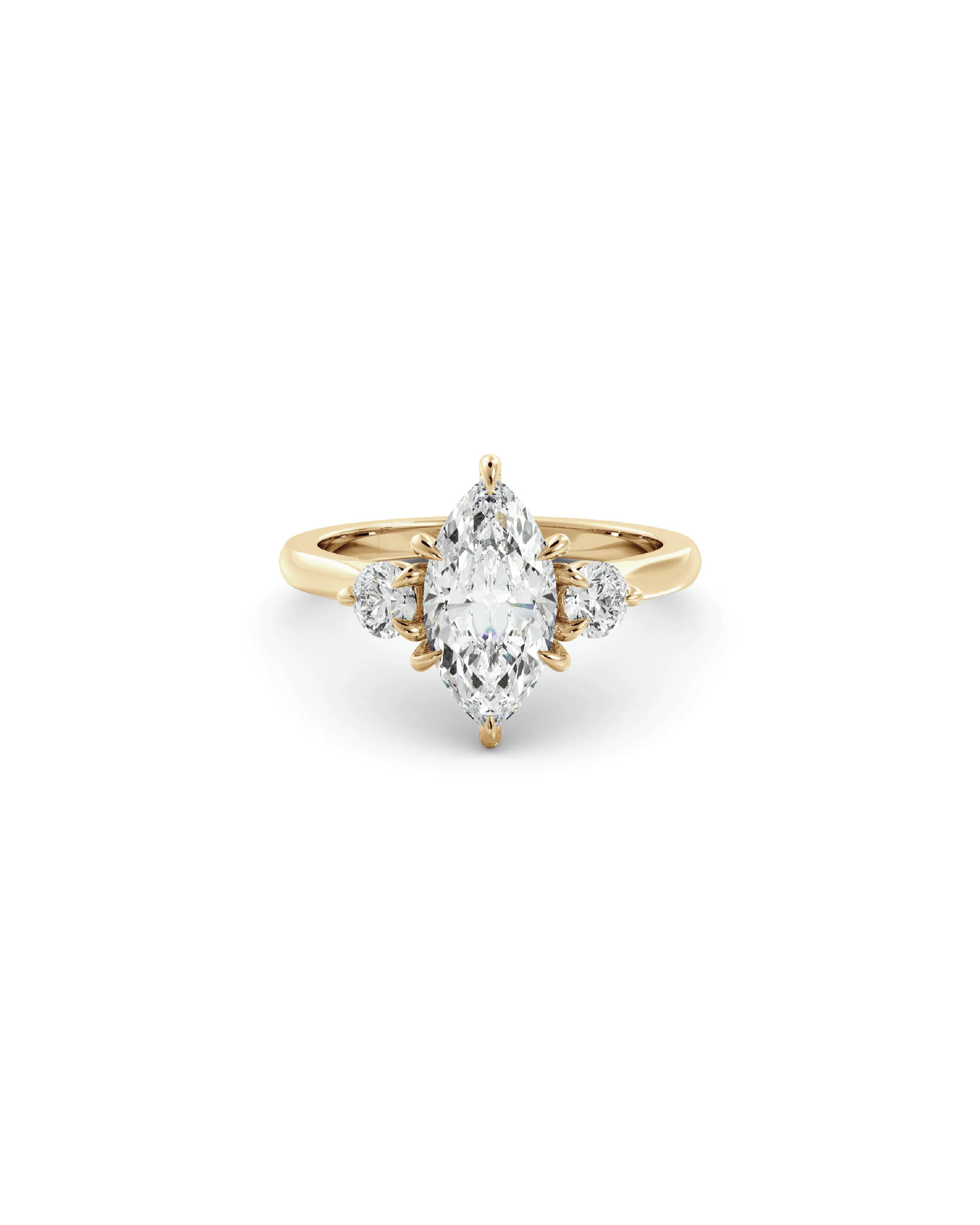 A marquise three-stone ring with a central diamond and accent round brilliant cut diamonds set in 18K yellow gold.