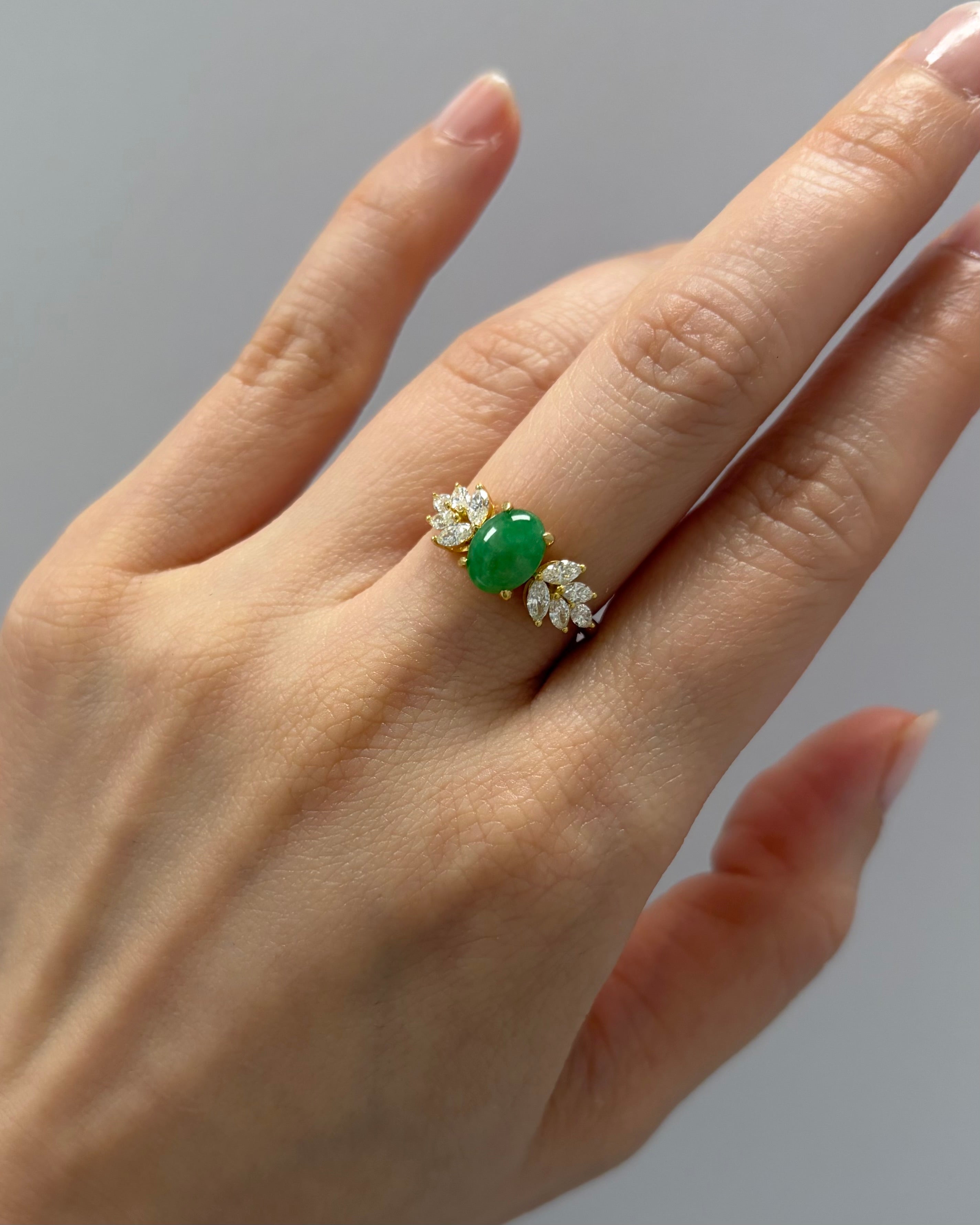 Green jade statement ring with marquise diamond accents
