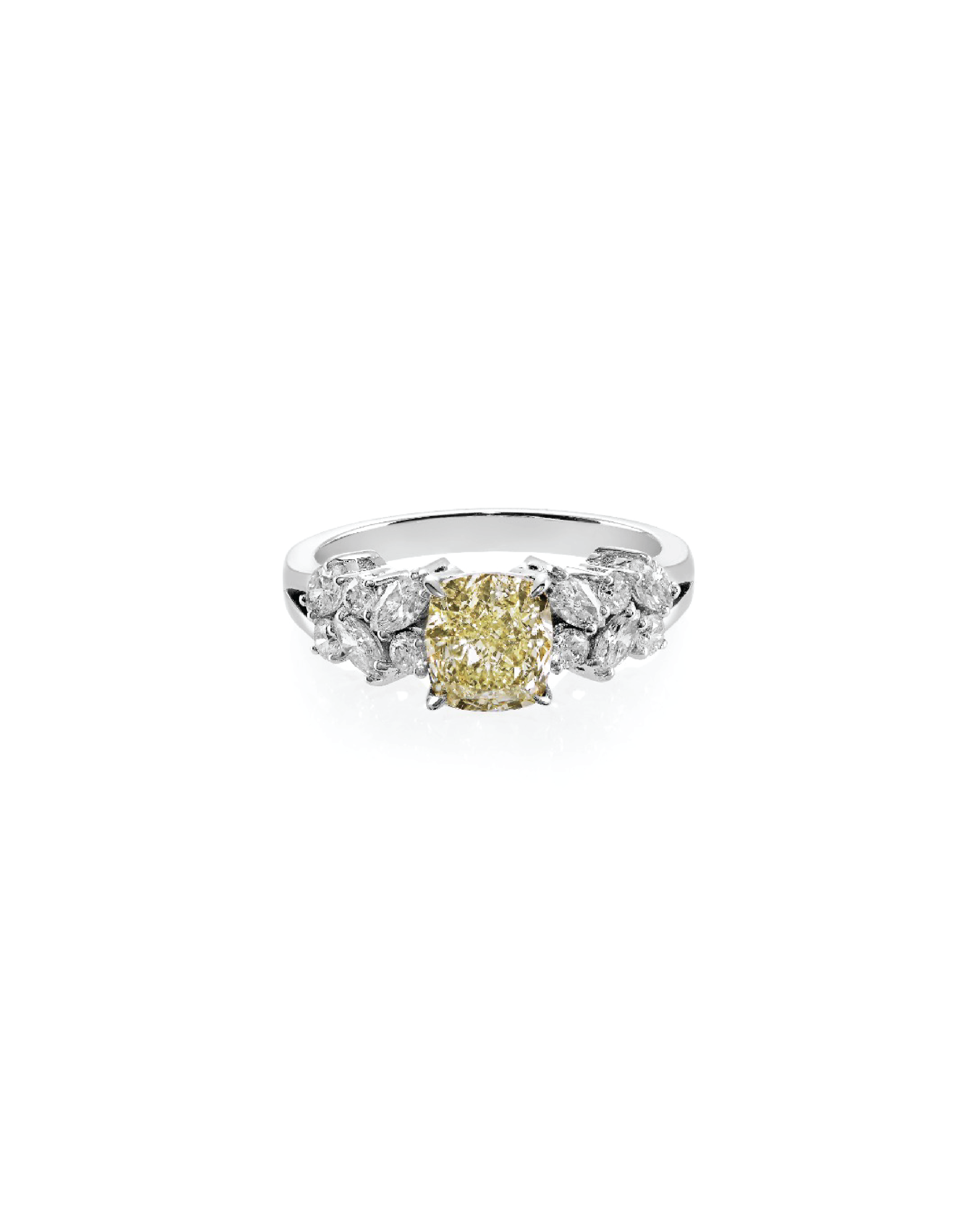 Diamond ring with a yellow center stone on a white background