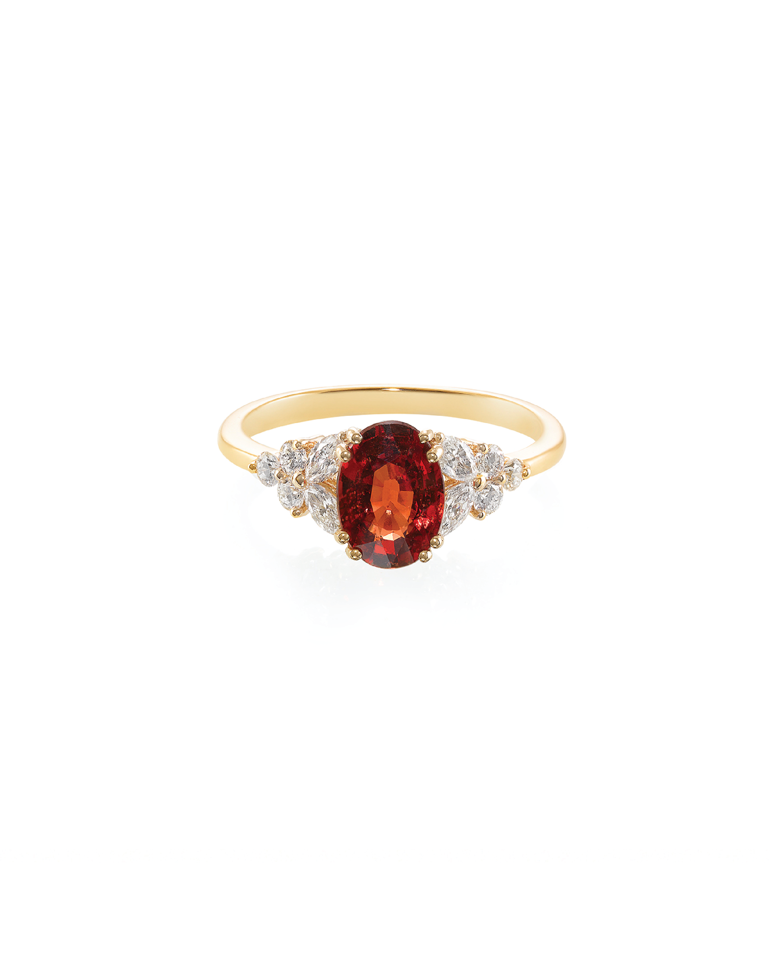 An orange sapphire ring with marquise and round brilliant cut diamonds set in yellow gold.