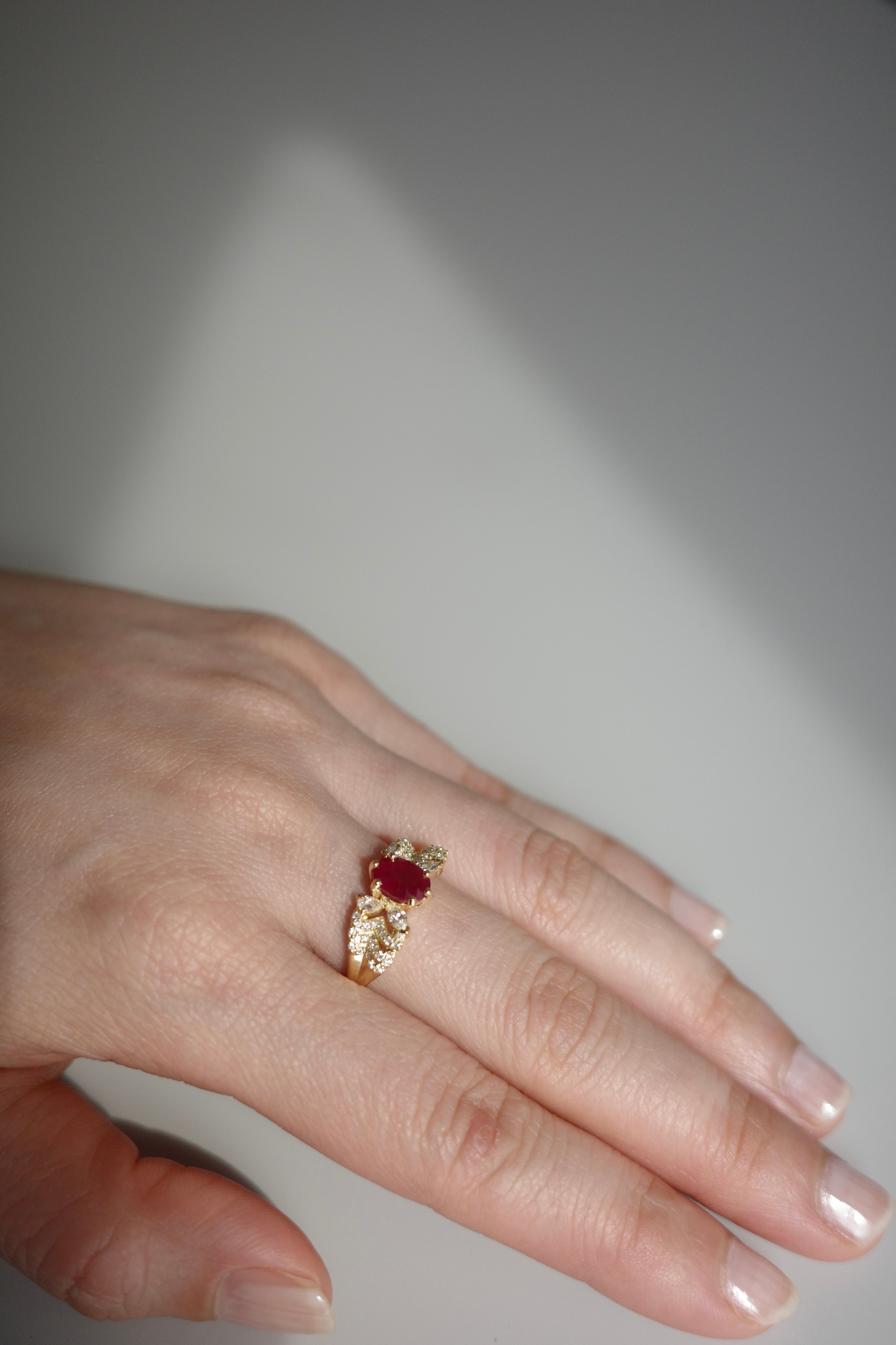 Ruby butterfly engagement ring in 14k solid gold with a 1ct oval ruby center stone