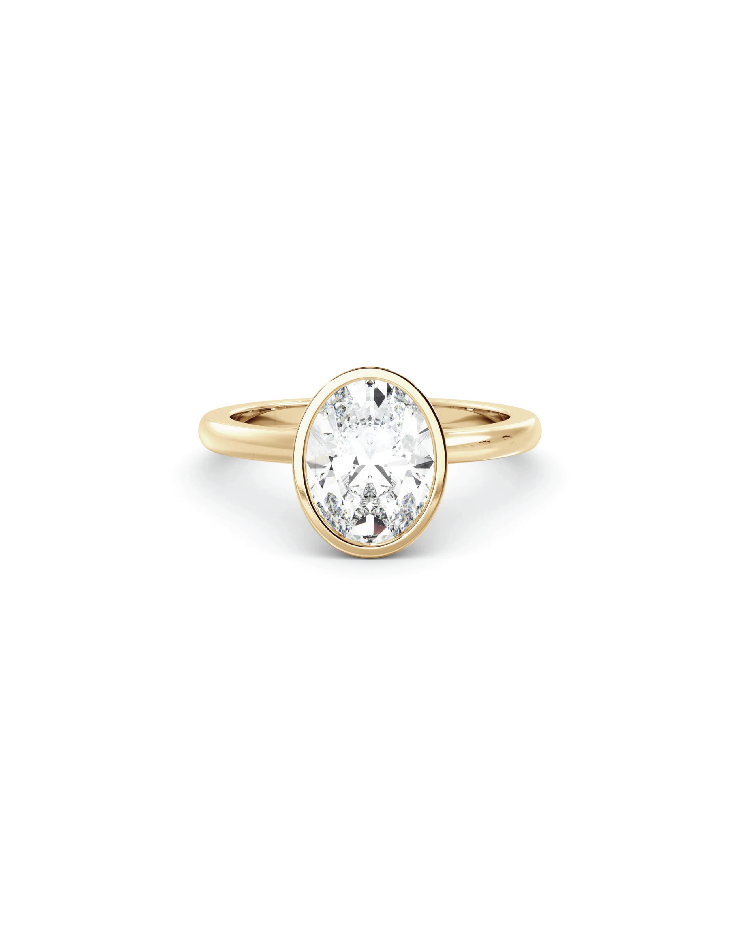 An oval bezel solitaire ring with a clear diamond in the center, set in a 18K yellow gold band.