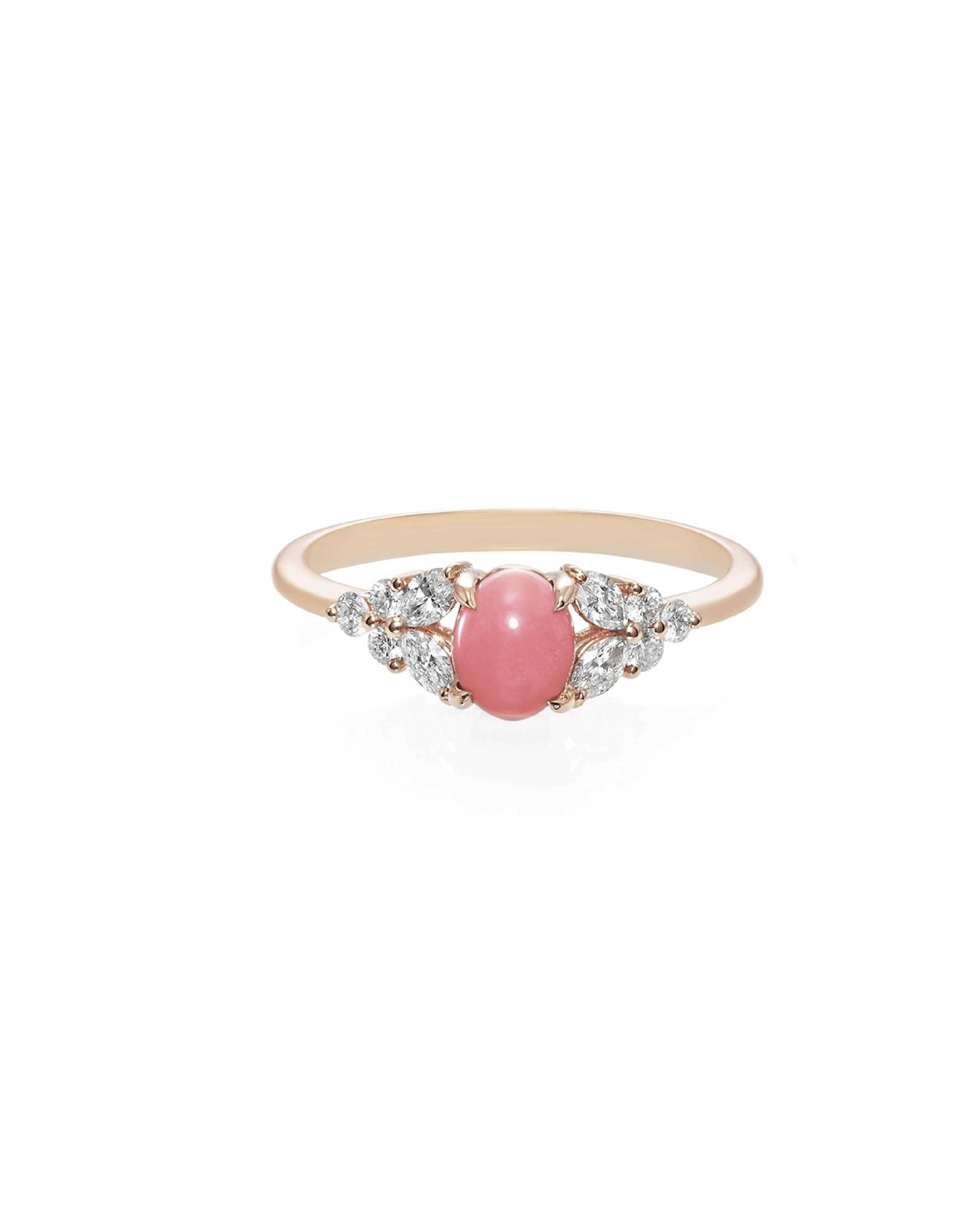 A white gold ring featuring a central conch pearl with marquise and round cut diamonds