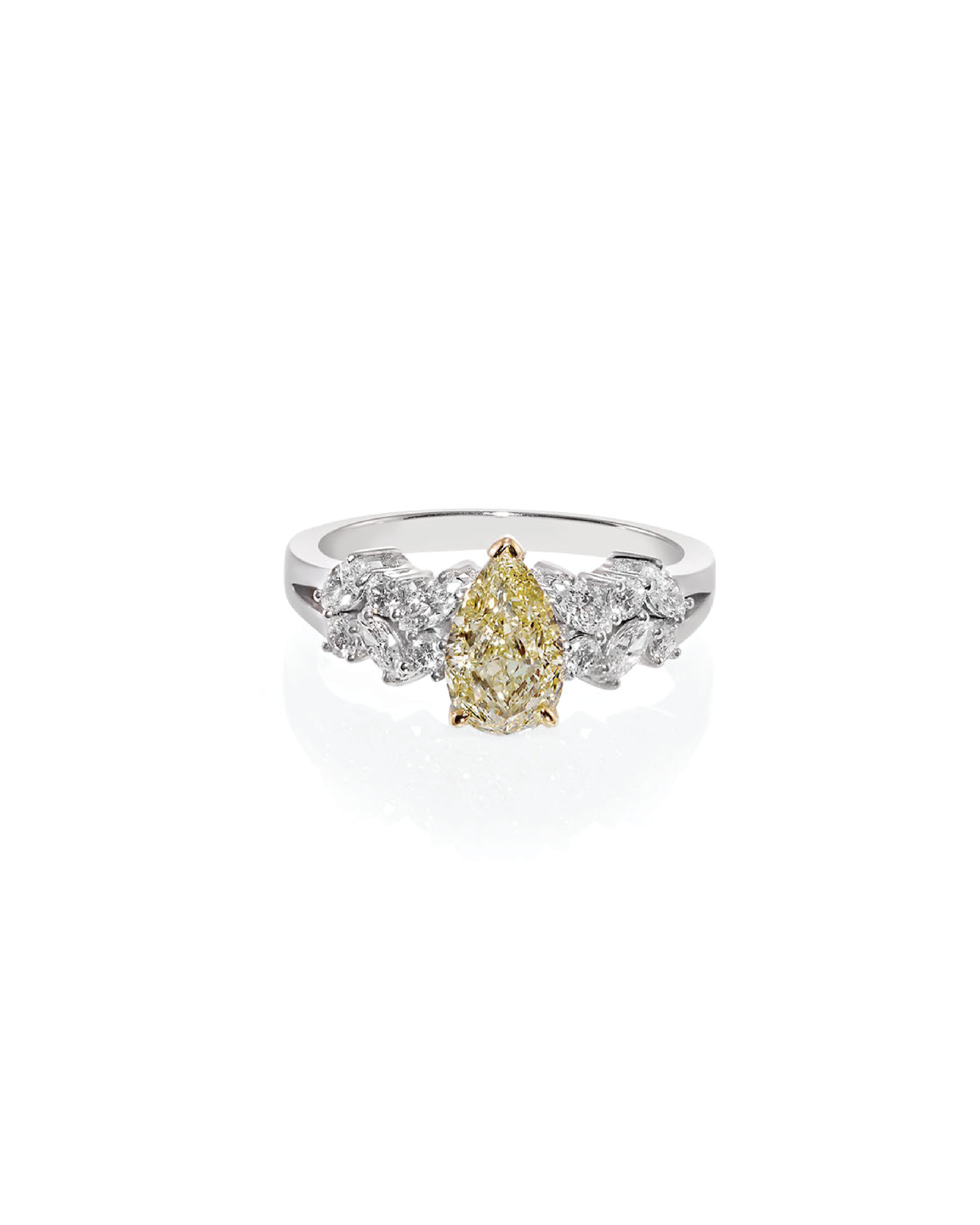 Ring with pear-shaped yellow diamond and smaller white diamonds on a white background