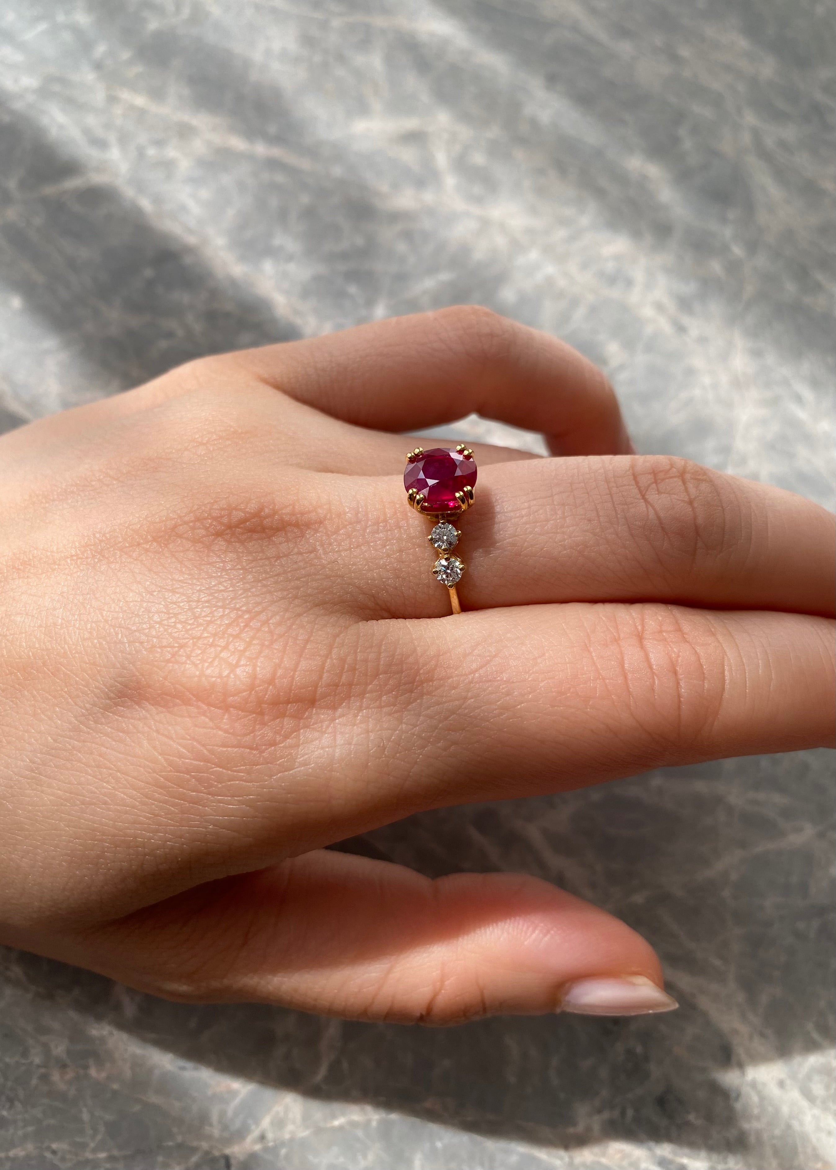 Solid gold natural ruby ring with delicate diamond details
