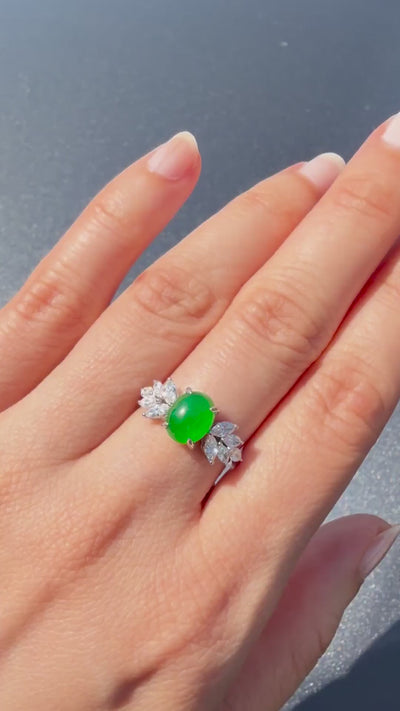 Imperial green oval jadeite cabochon ring with marquise diamond side clusters in solid white gold, HN JEWELRY