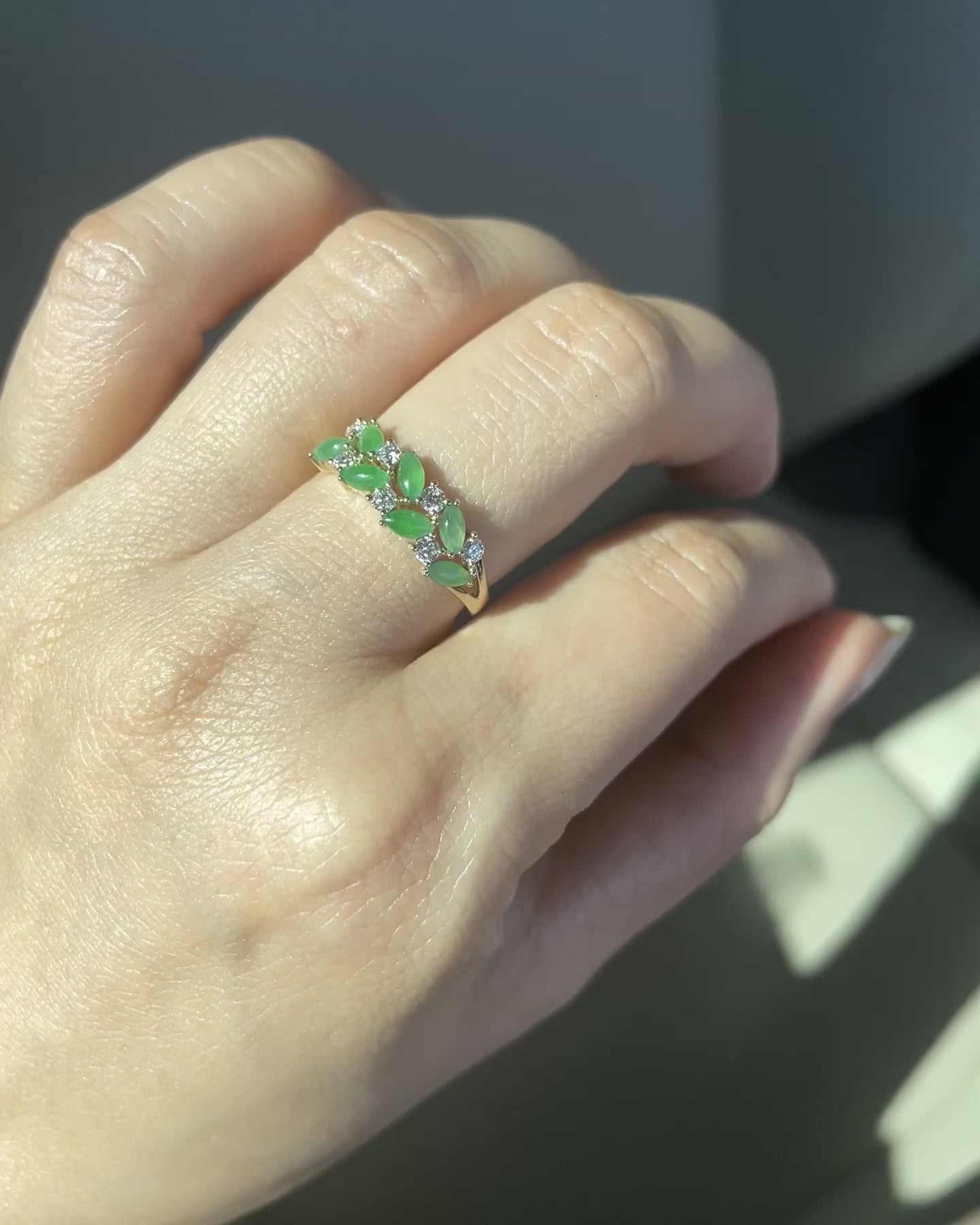 a wedding ring set with 7 natural marquise green jades and 7 round brilliant cut diamonds 
