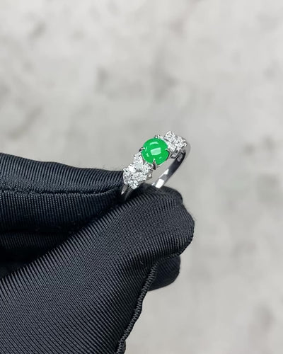 a video of a natural green jade and diamond ring 