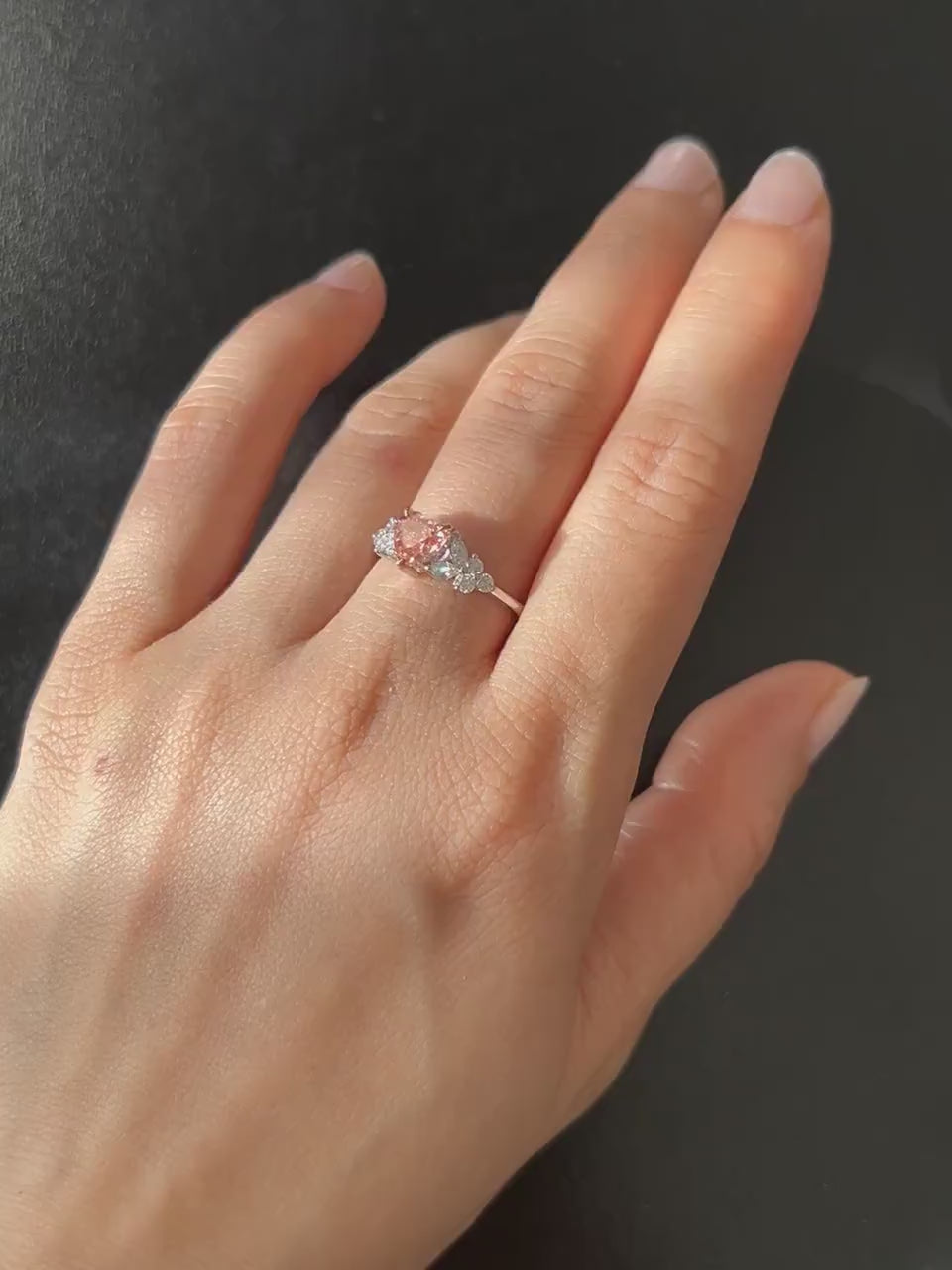 a lady wear a heart shape pink diamond ring