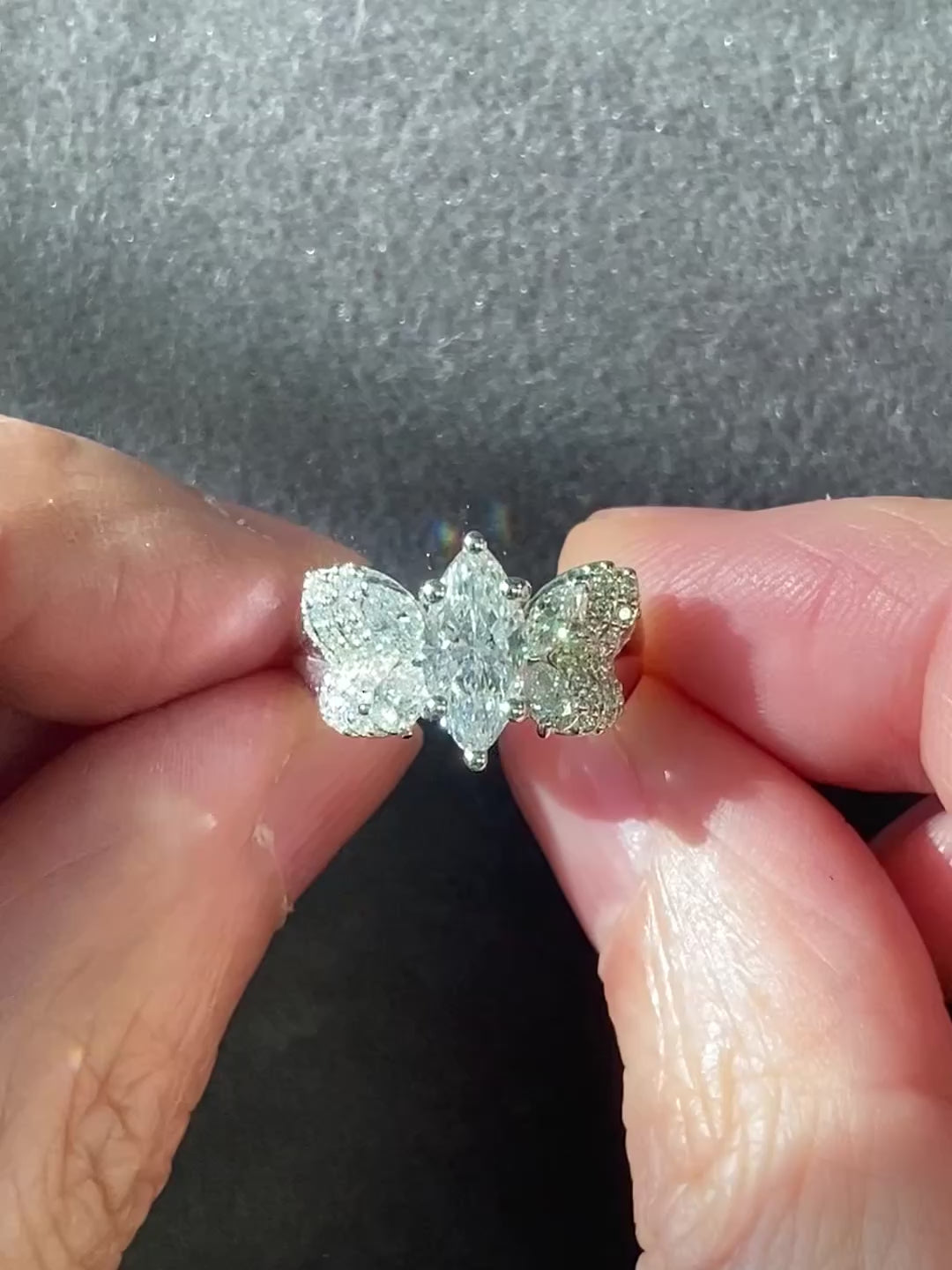 Custom butterfly engagement ring with marquise diamond