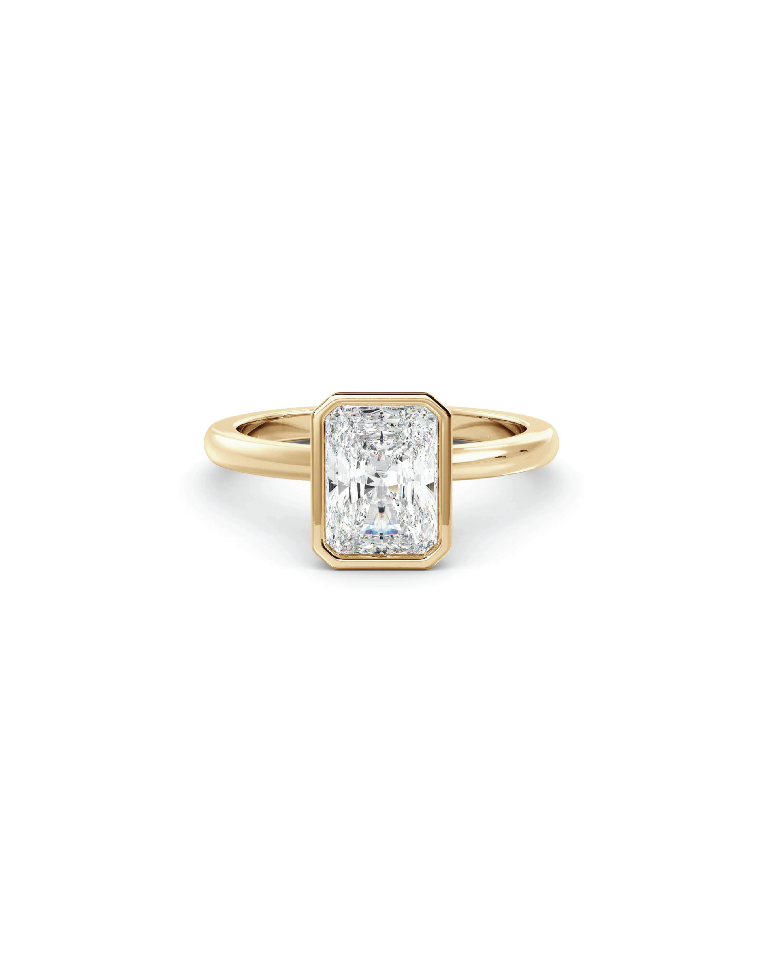 A radiant cut diamond solitaire ring with a bezel setting in 18K yellow gold.