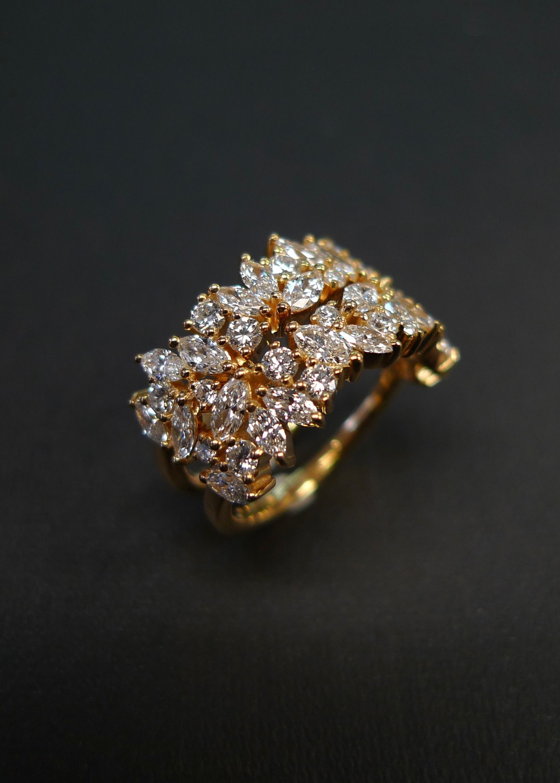Yellow gold diamond wedding band with alternating marquise and round stones