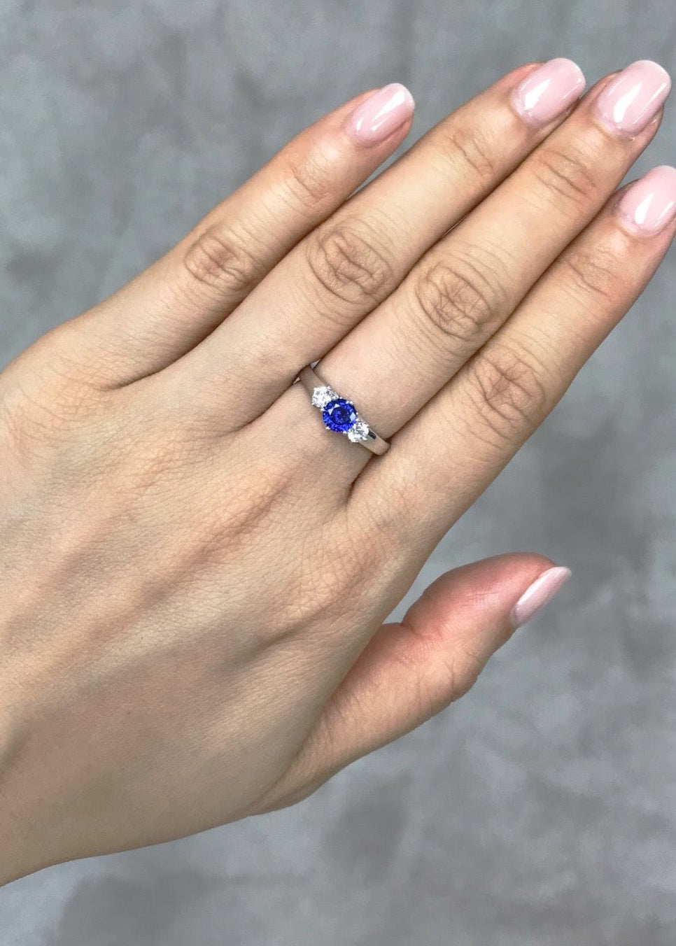Round blue sapphire and white sapphire ring in solid white gold by HN Jewelry