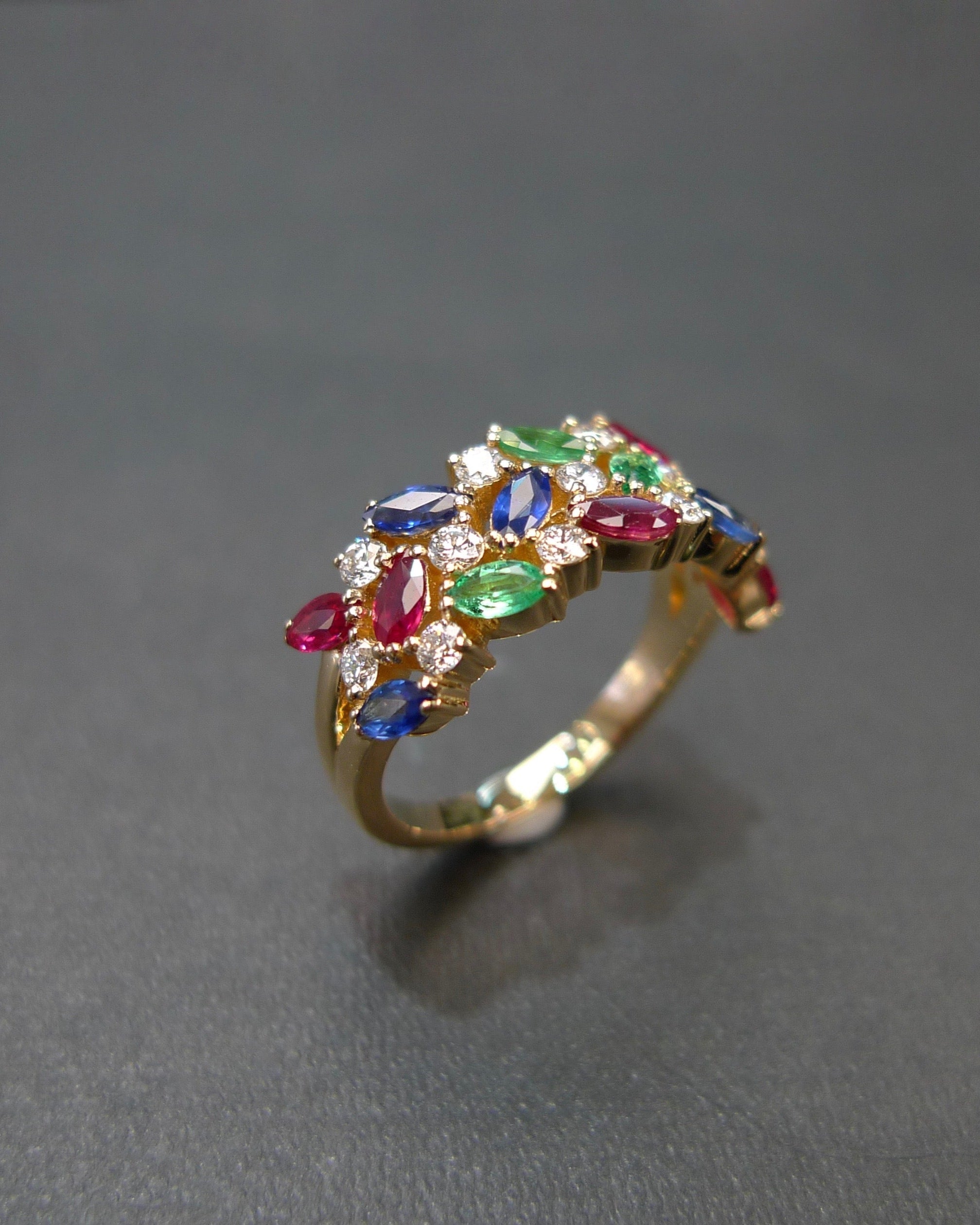 Colorful marquise gemstones and round brilliant cut diamond ring with ruby sapphire emerald in gold