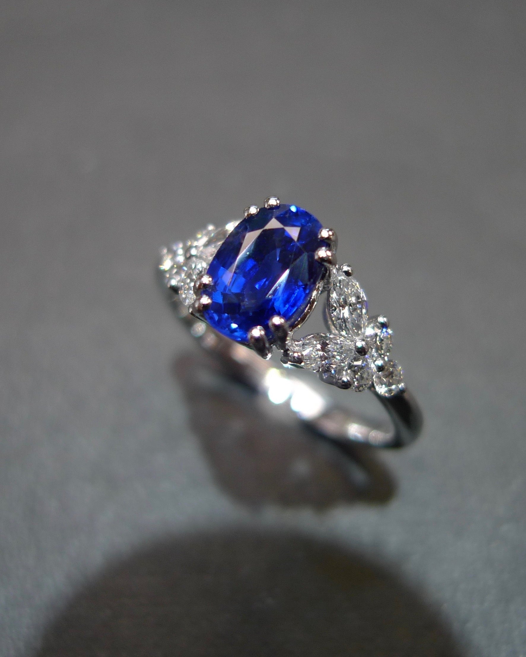 close up view of sapphire and diamond fine jewelry ring